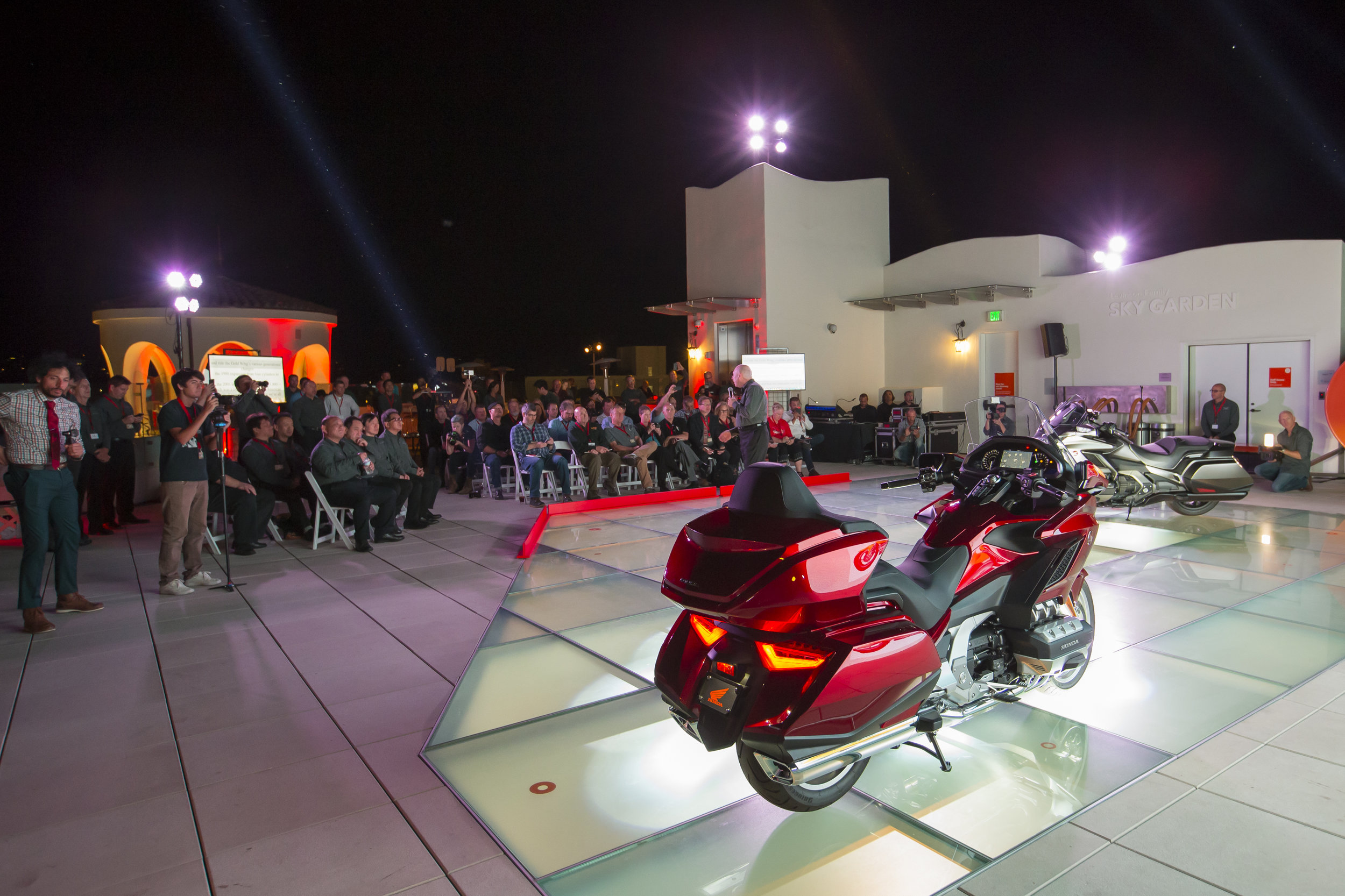 The unveiling itself was held not in a generic conference room, but on the MOXI's outdoor rooftop. Using the glass floor section as the stage allowed unique lighting from below. Image: Kevin Wing