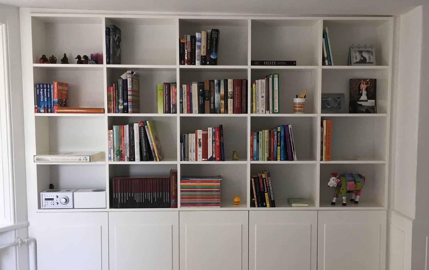 bookcase after - books arranged in happy direction 📈