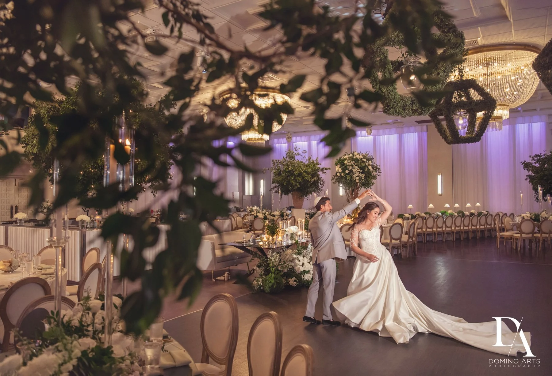 Bride and groom sharing their first dance inside the elegant ballroom at Emanuel Luxury Venue in Miami Beach.
