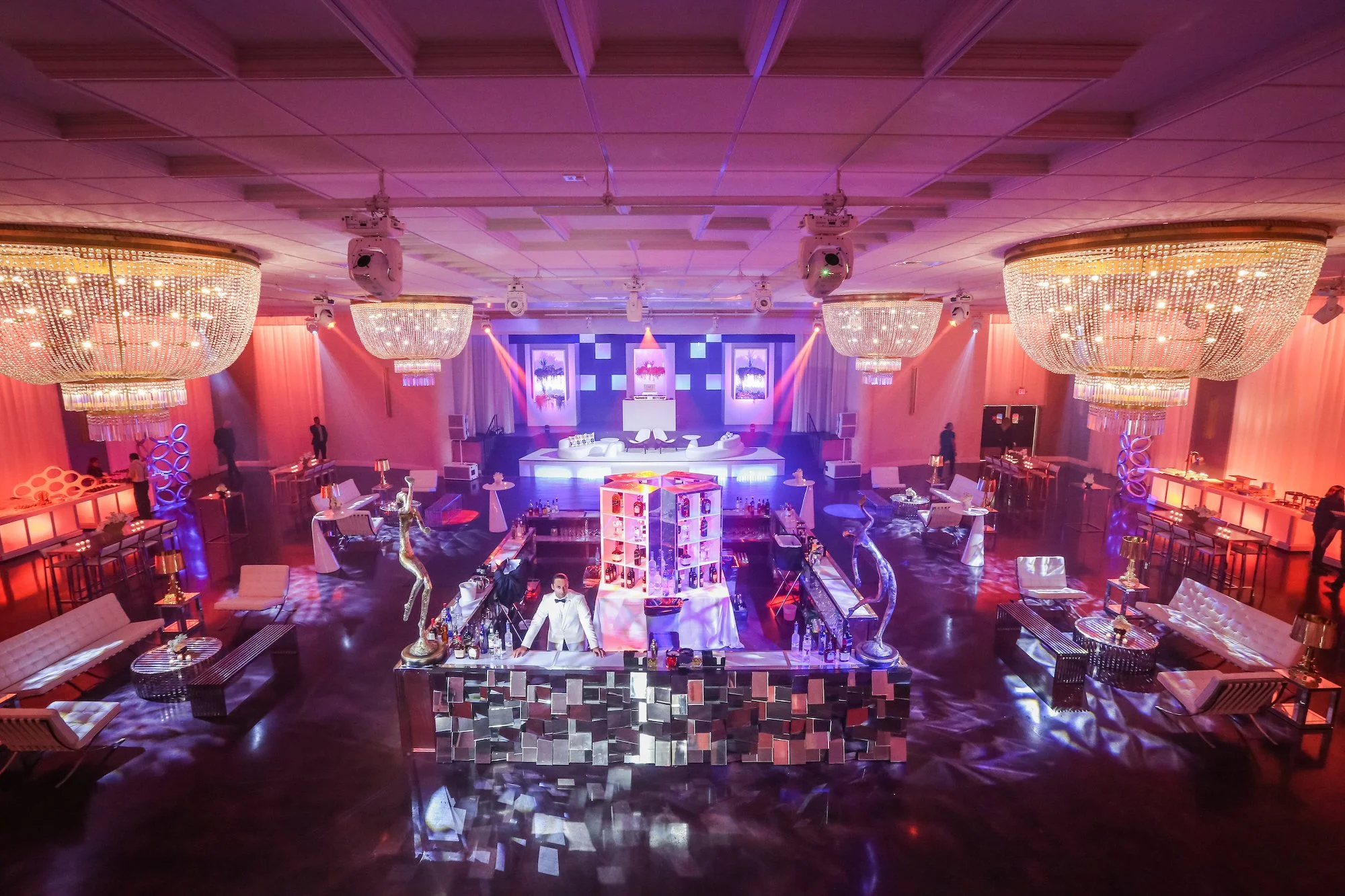 Luxury Art Basel Miami event setup inside Emanuel Luxury Venue ballroom in Miami Beach, featuring chandeliers, stage lighting, and brand activation space for Miami Art Week events