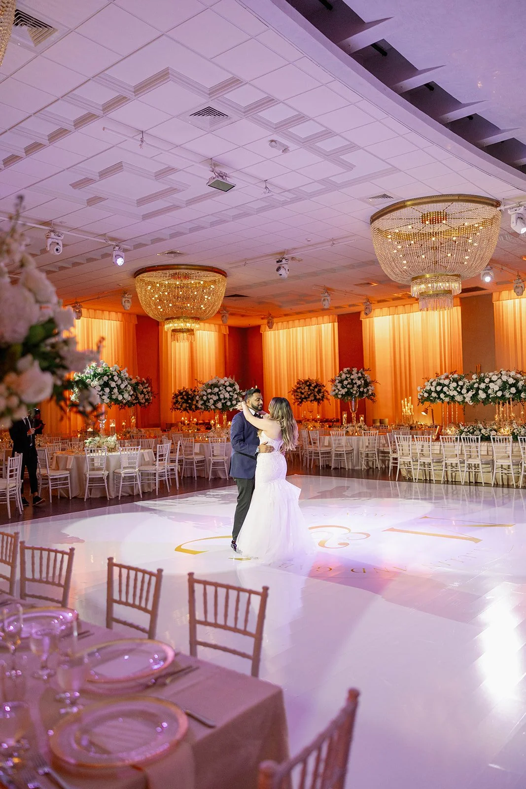 Bride and groom standing together inside the elegant ballroom at Emanuel Luxury Venue, a Miami wedding venue.