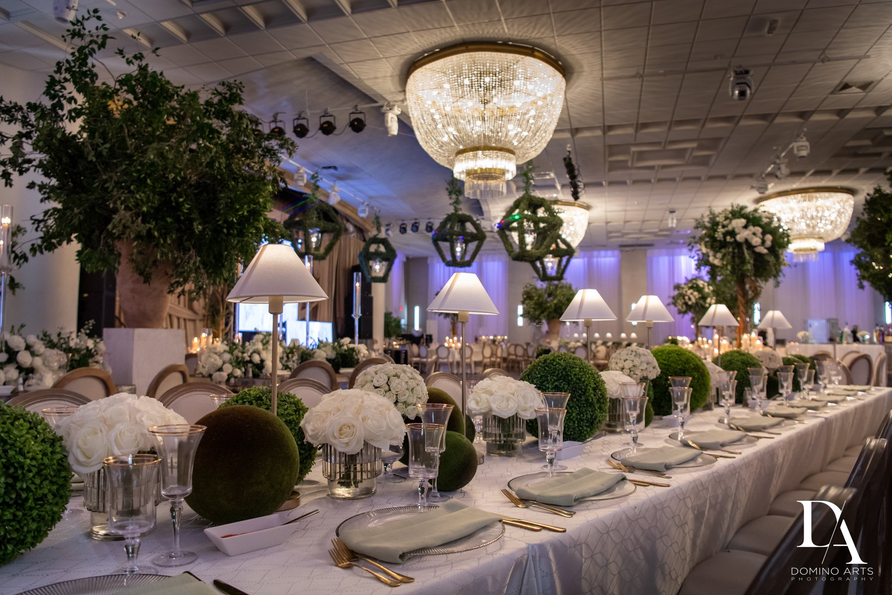 Elegant wedding tablescape with candlelight and floral arrangements at Emanuel Luxury Venue, a top Miami wedding venue.