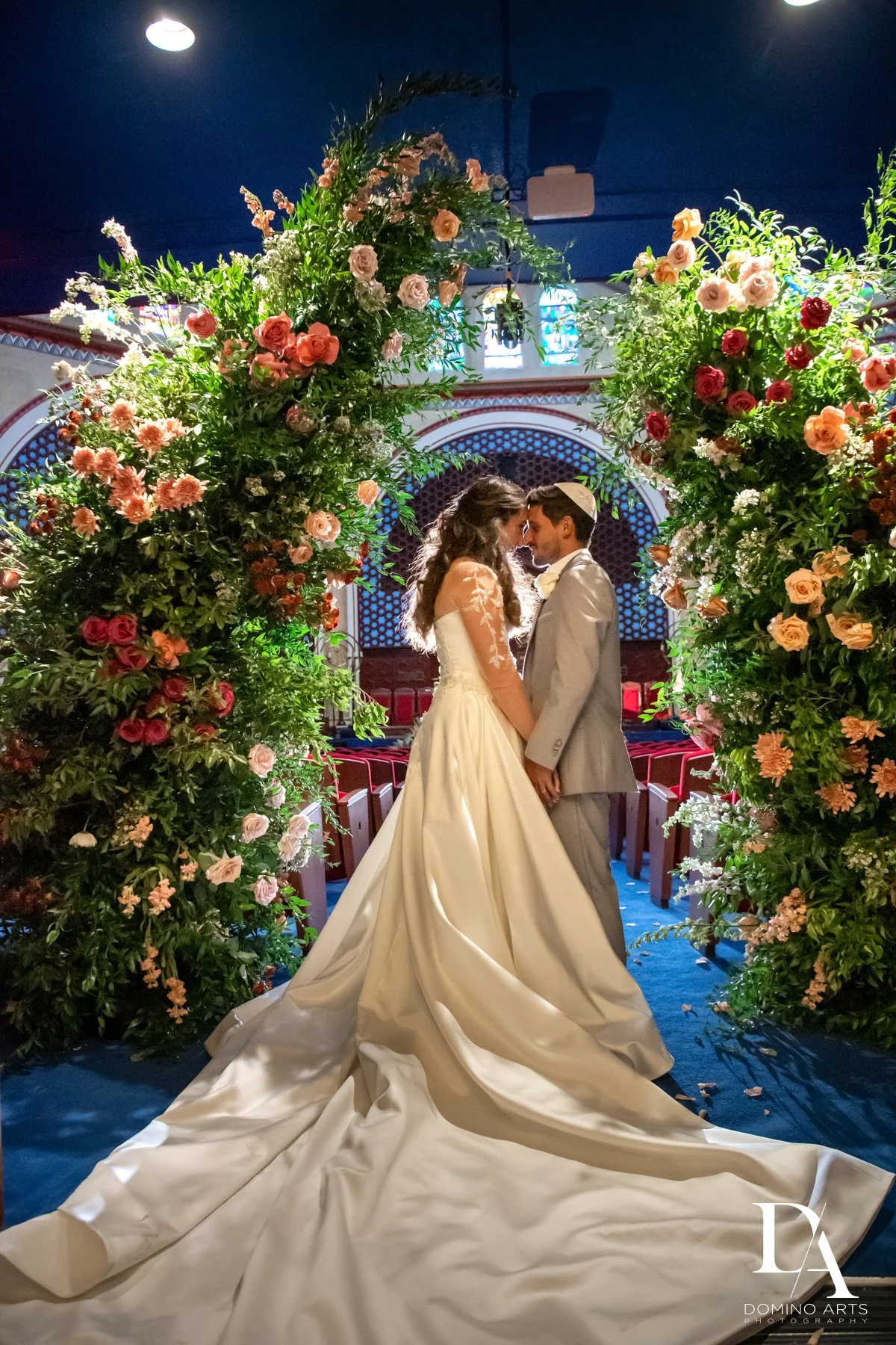 Bride and groom celebrating their wedding reception at Emanuel Luxury Venue, a luxury Miami Beach wedding venue.