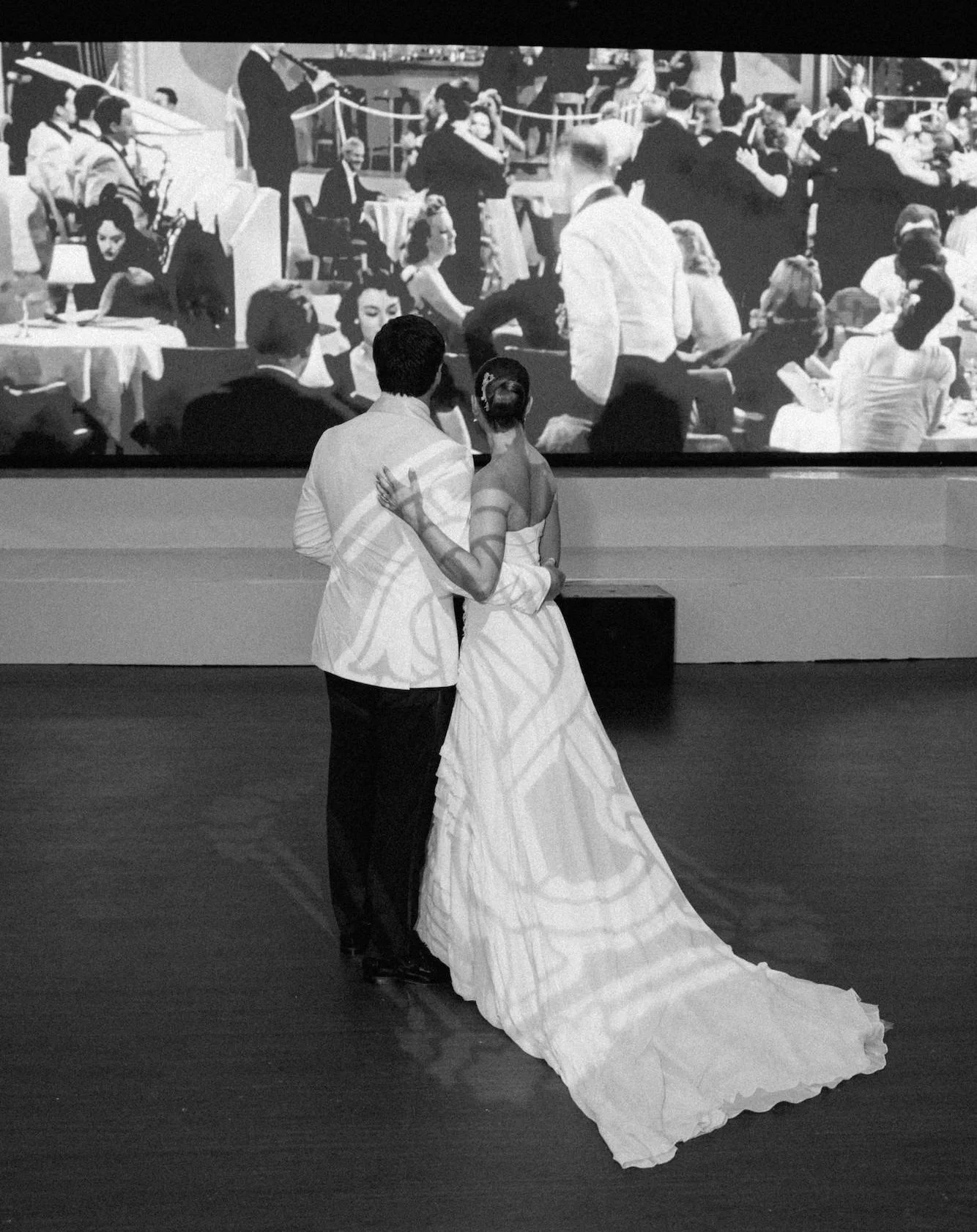 Wedding reception in Miami Beach ballroom featuring LED wall backdrop at Emanuel Luxury Venue