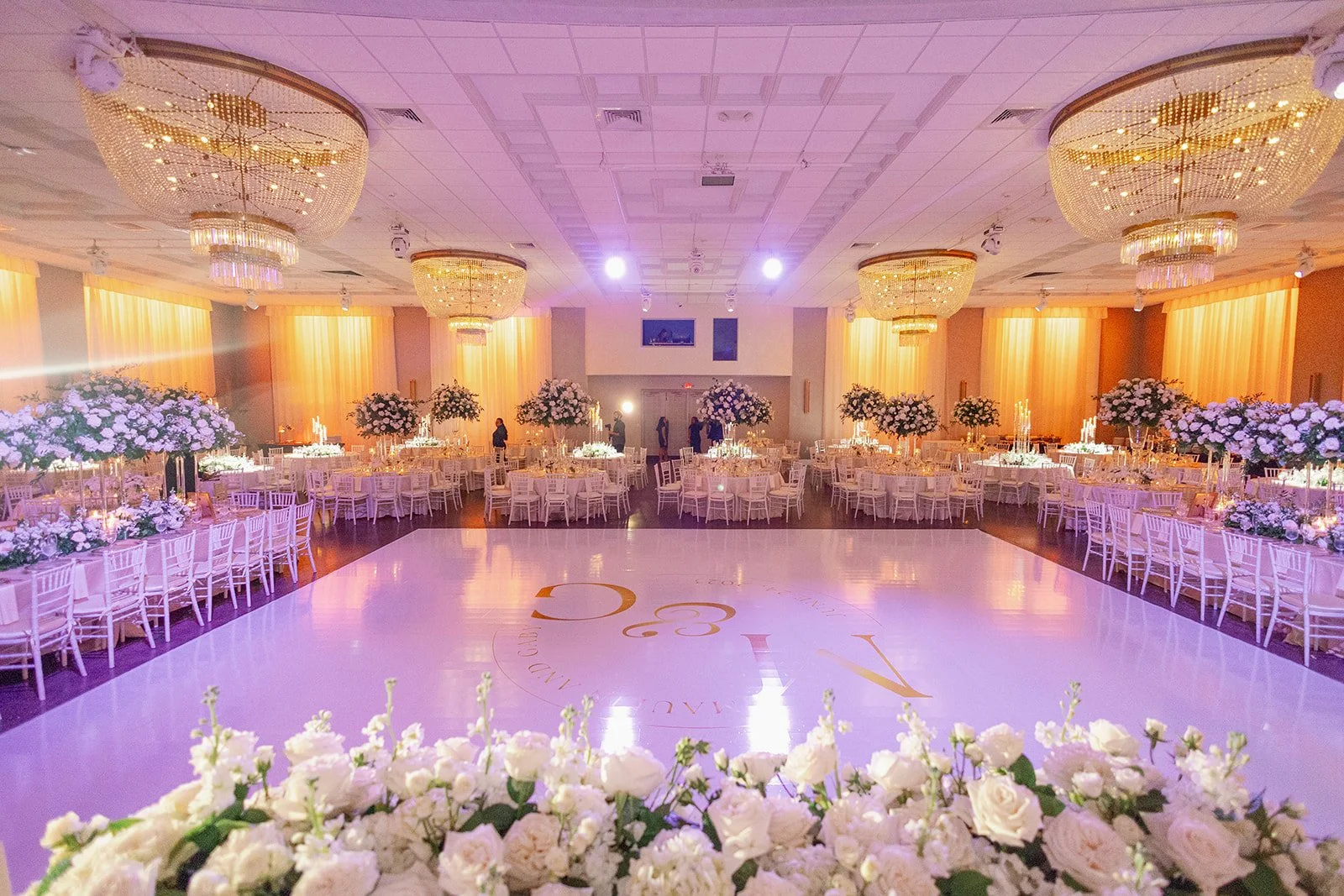 Elegant ballroom setup for a wedding reception at Emanuel Luxury Venue in Miami.