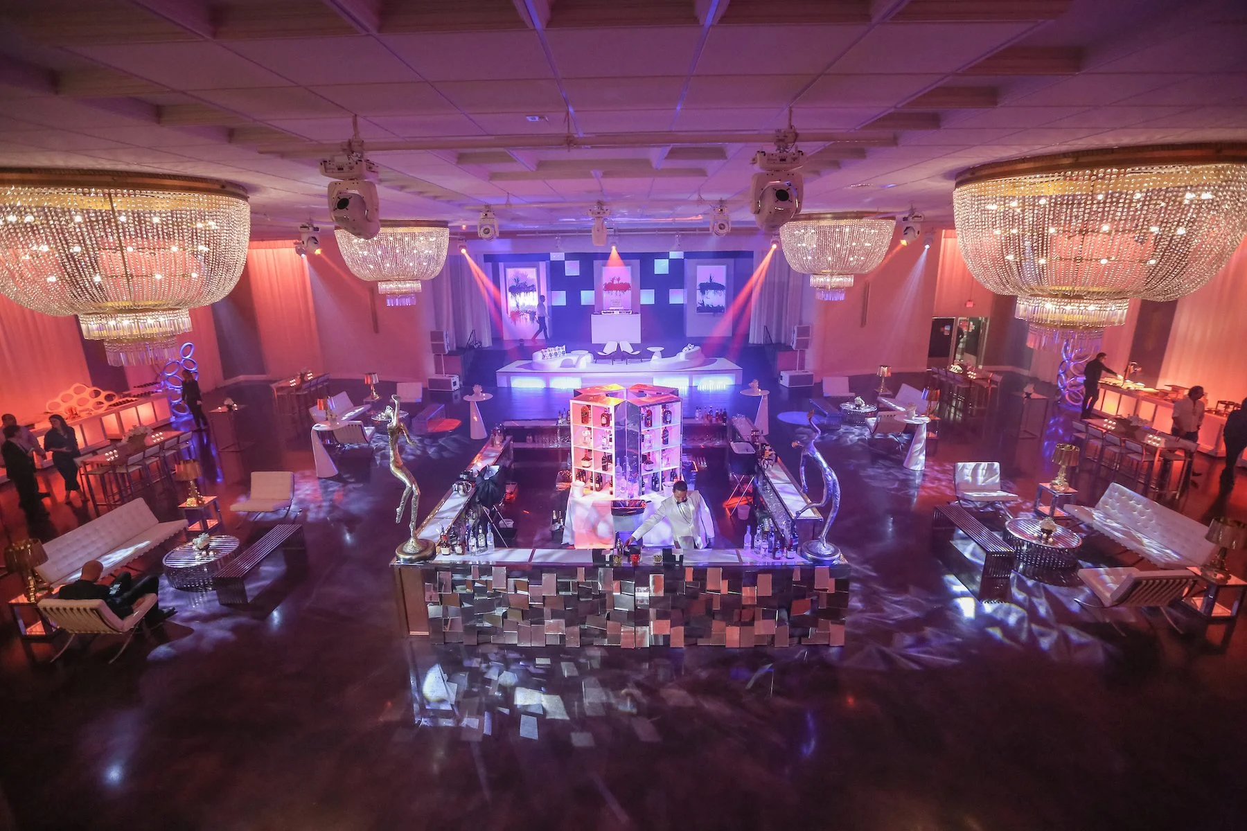 Luxury Bar Mitzvah event setup at a Miami Beach banquet hall with elegant chandeliers, LED lighting, custom bar design and spacious dance floor at a premier Miami event venue