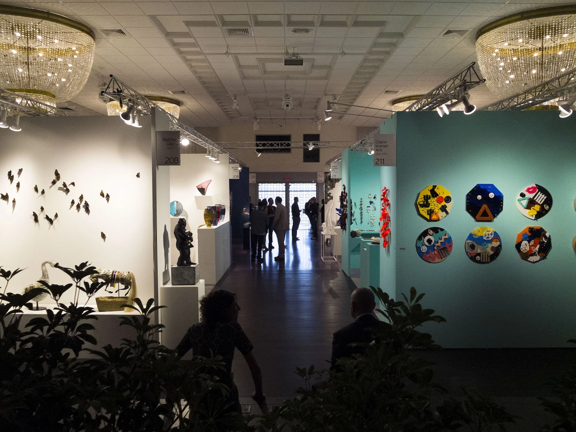 Public art fair at Emanuel Luxury Venue in Miami Beach with visitors viewing contemporary artwork