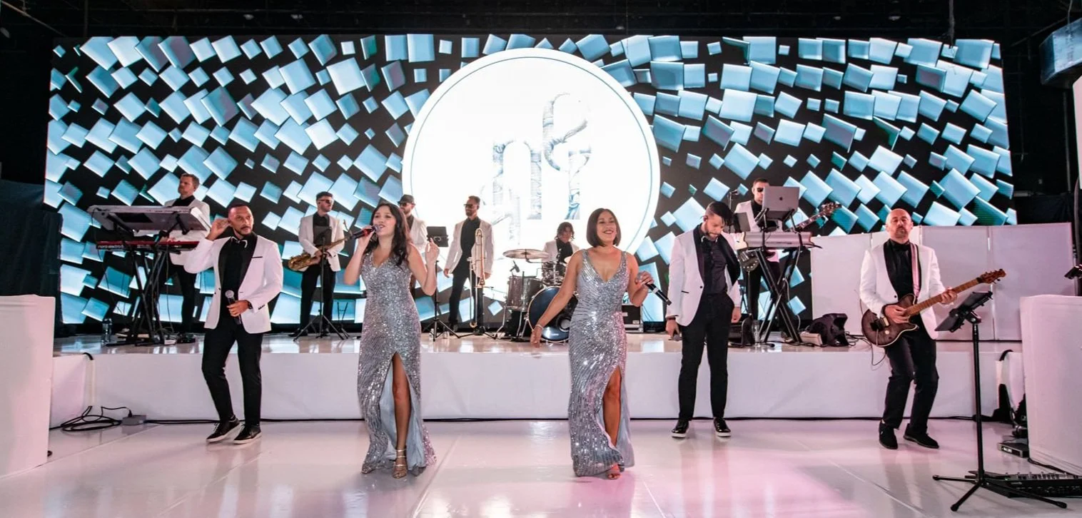 Corporate conference presentation at Miami event venue with built-in LED wall