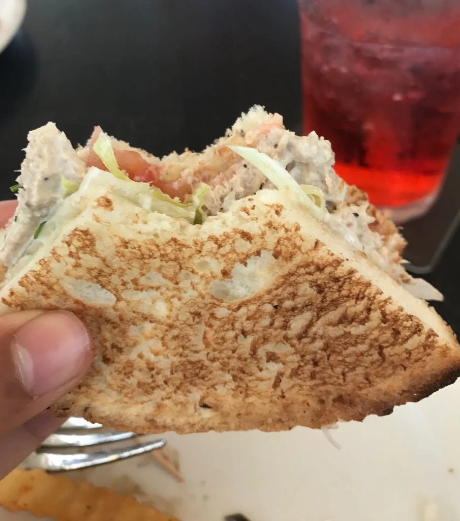 Thai chicken sandwich with a bite.jpeg