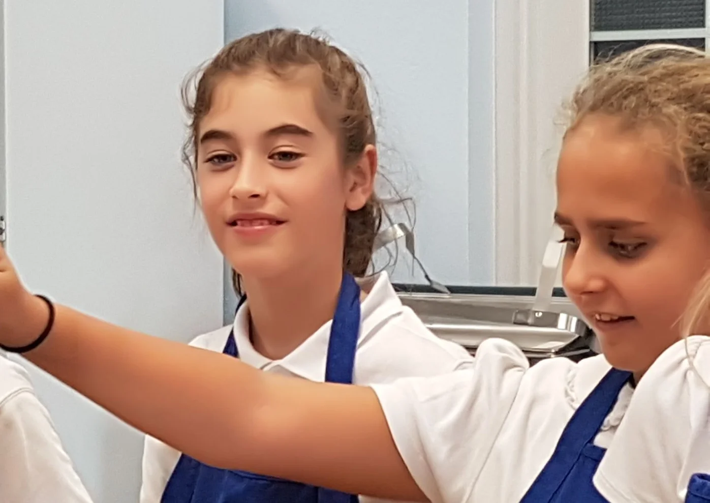 Anisa and Adrianna helping out!
