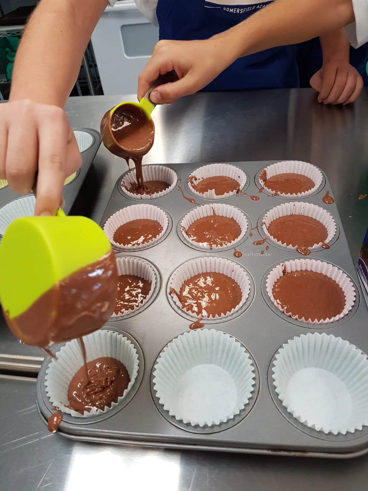 pouring batter in tins.jpeg