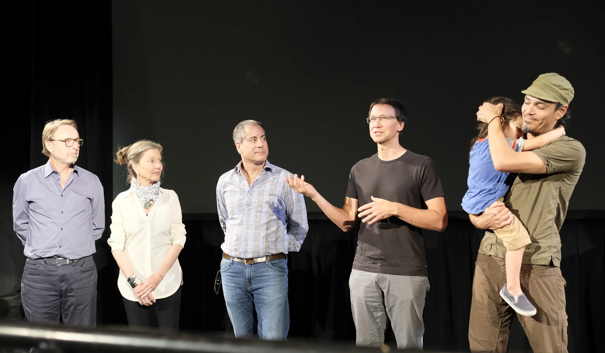 Brad Kremer, 4th from left, discusses his filmmaking process at SCFF 2017. To his right (with child) is Earthscape Artist Andres Amador, lead actor/subject of the film. 