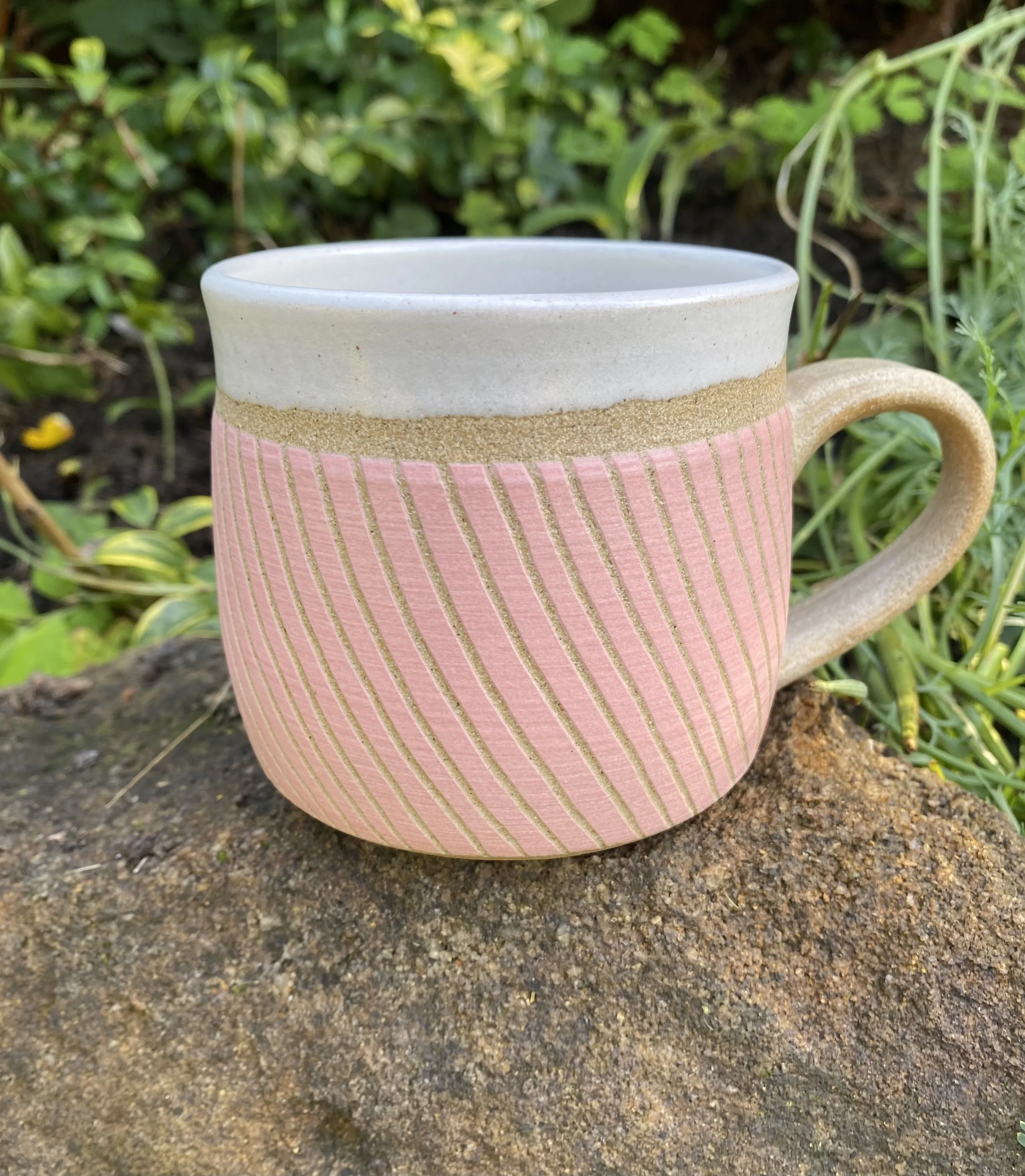 4. Pink linear stoneware cup.