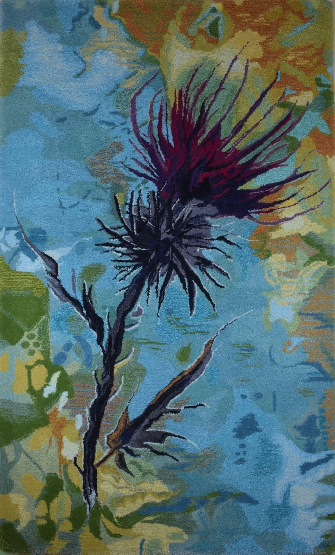 A hand tufted wool pile textile hearth rug of a thistle plant with purple and green hues set against a multicolored abstract background.