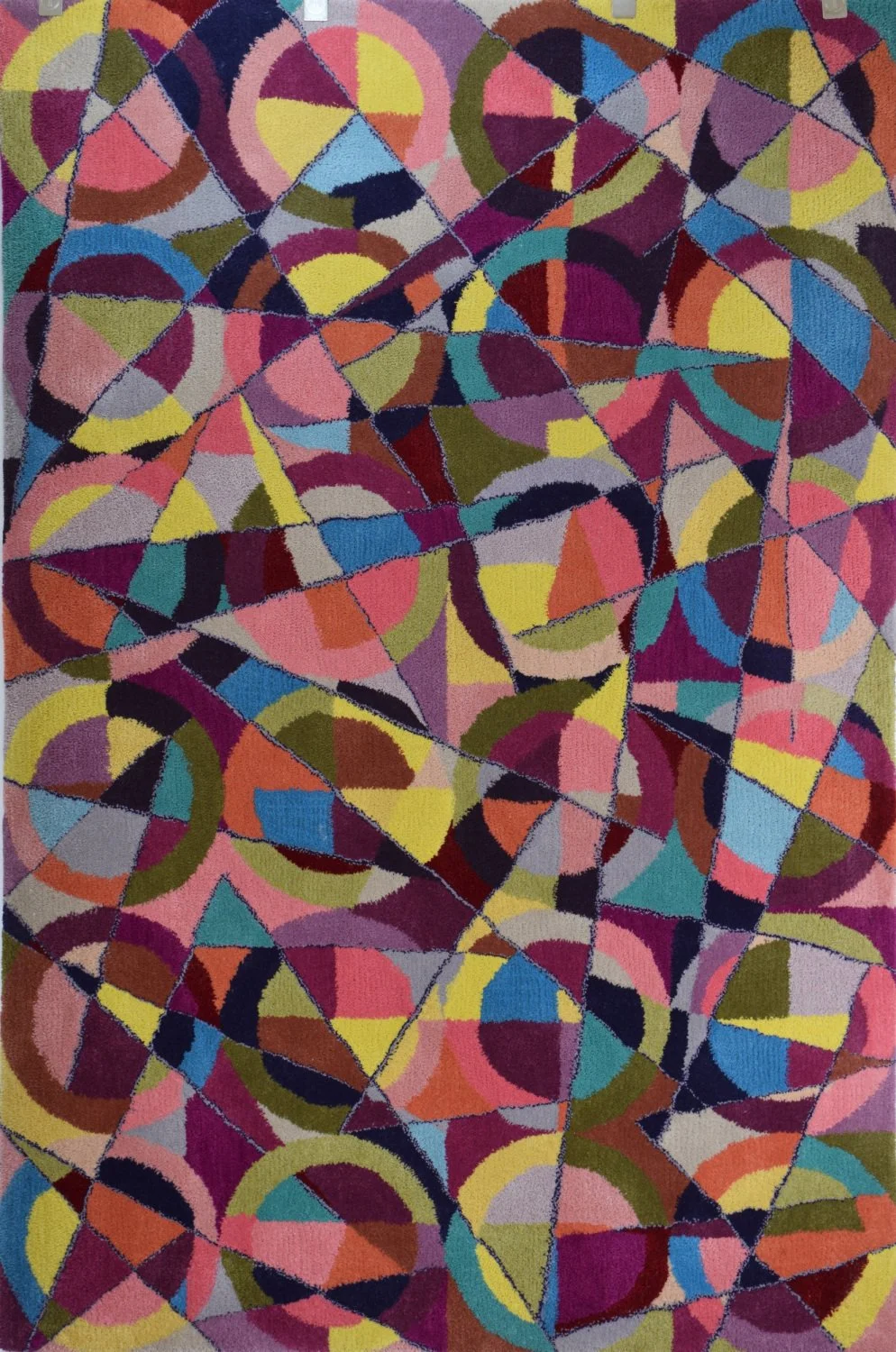 Abstract geometric hand tufted hearth rug featuring overlapping multicolored circular and triangular shapes separated by black lines.