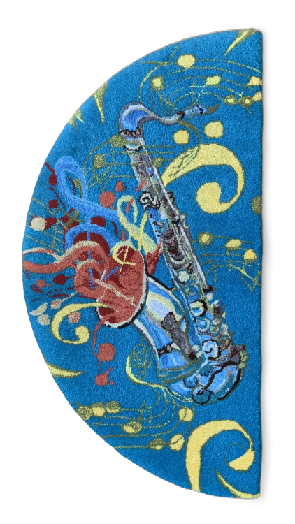A colorful half moon rug featuring a saxaphone surrounded by swirls and bubbles on a bright blue background.