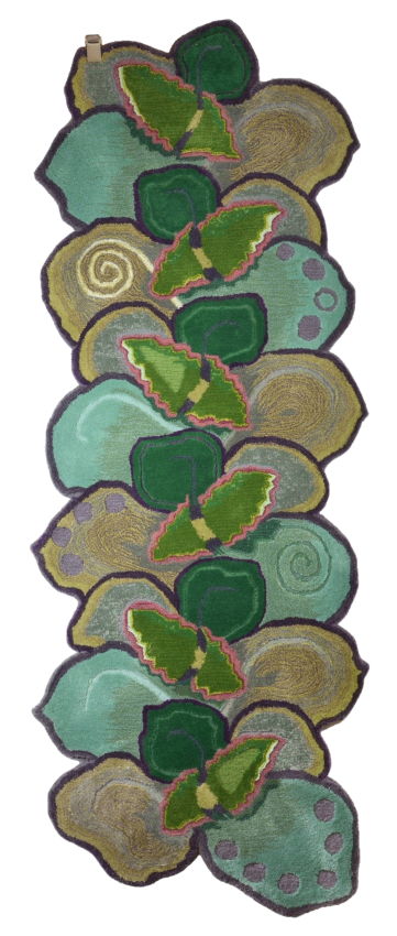 A vertical pattern of abstract hand tufted shapes in green, gold, beige, and purple, resembling leaves, shells, and other organic forms.