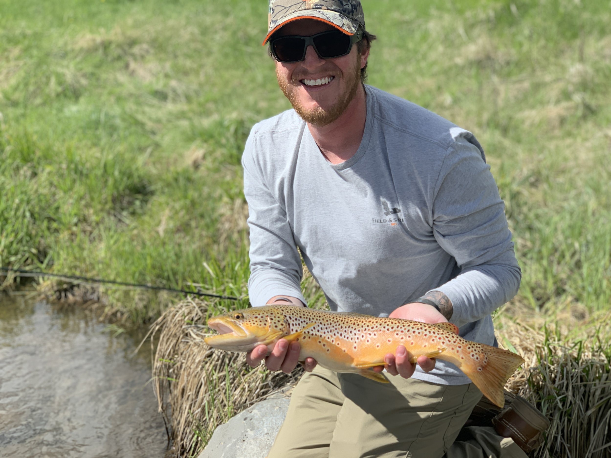 Ryan with his STUD brown at Trout Stalker Ranch. This is the kind of smile and handful of fish we strive for here at AWOL.