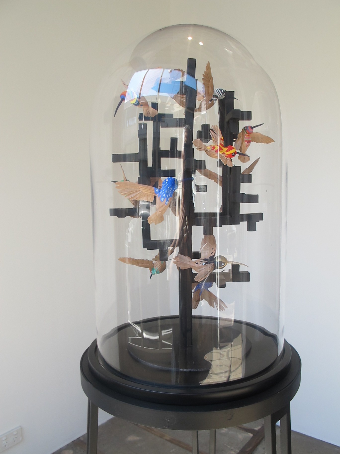  Simon MacEwan,&nbsp; Peace through understanding , 2011, steel, handcrafted cedar birds, gouache, glass dome, 160 x 40 x 40cm 