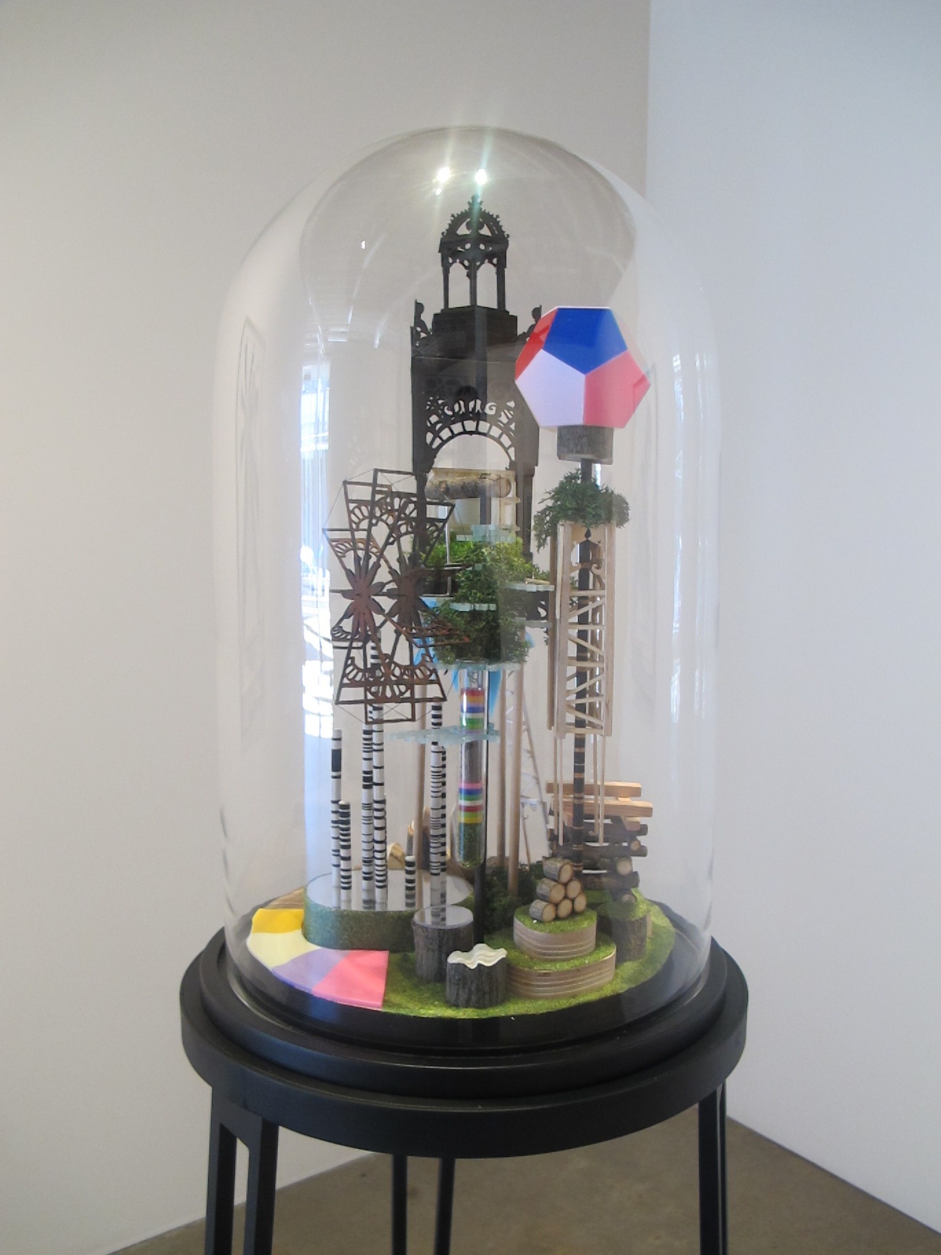  Simon MacEwan,&nbsp; The works of industry of all nations , 2011, steel, wood, perspex, foam, wood veneer, lichen, model grass, ping pong ball, glass dome, 160 x 40 x 40cm 