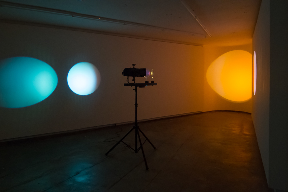  Michaela Gleave,&nbsp; Eclipse Machine (Magenta, Orange) , 2015 Theatre lamp, dichroic filters, motors, powder coated aluminium, stand Installation view: Firstdraft Gallery, as part of the exhibition As if light could be translated, curated by Art P