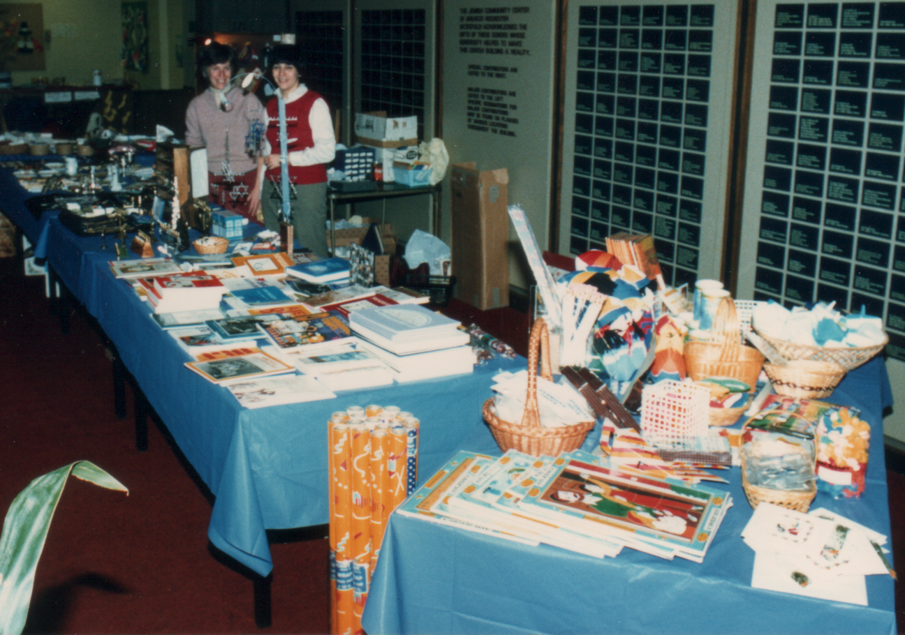 My Mom, on the right, running the Chanukah bazaar in the late 80s.