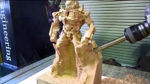 This wood Transformer can only be done with a true 5-axis CNC; note the angle of the carving tool, which is a 4th axis.