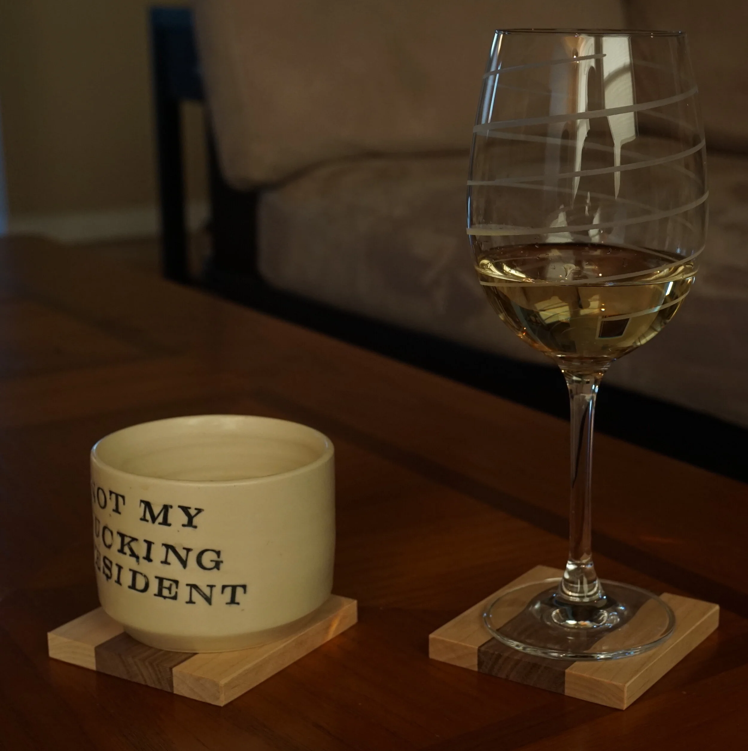 A 2017 photo of some earlier walnut and maple coasters.  Alas, the president outlasted my inventory of this popular design.