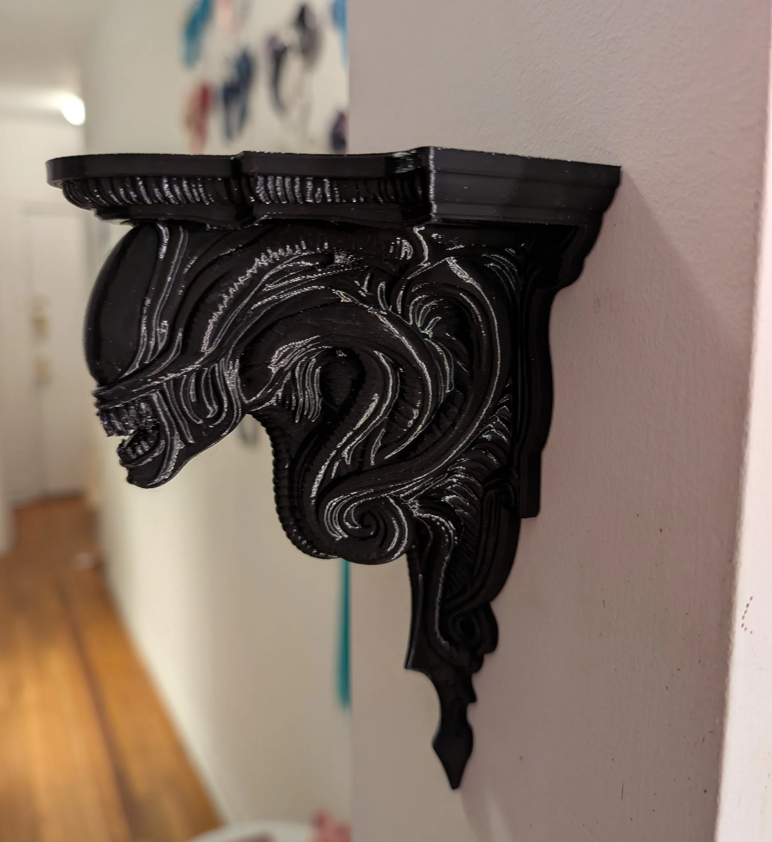 A xenomorph corbel shelf
