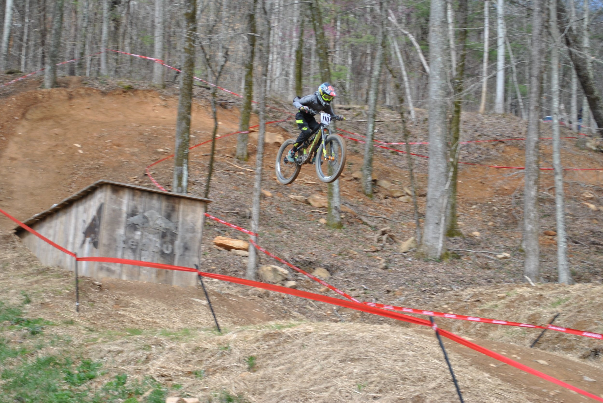 Christian Carbonell, Age 12, goes big at round two of Downhill Southeast at Windrock Bike Park.