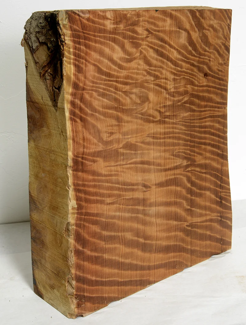 a massive block of highly figured/flamed vertical-grain reclaimed old growth redwood.
