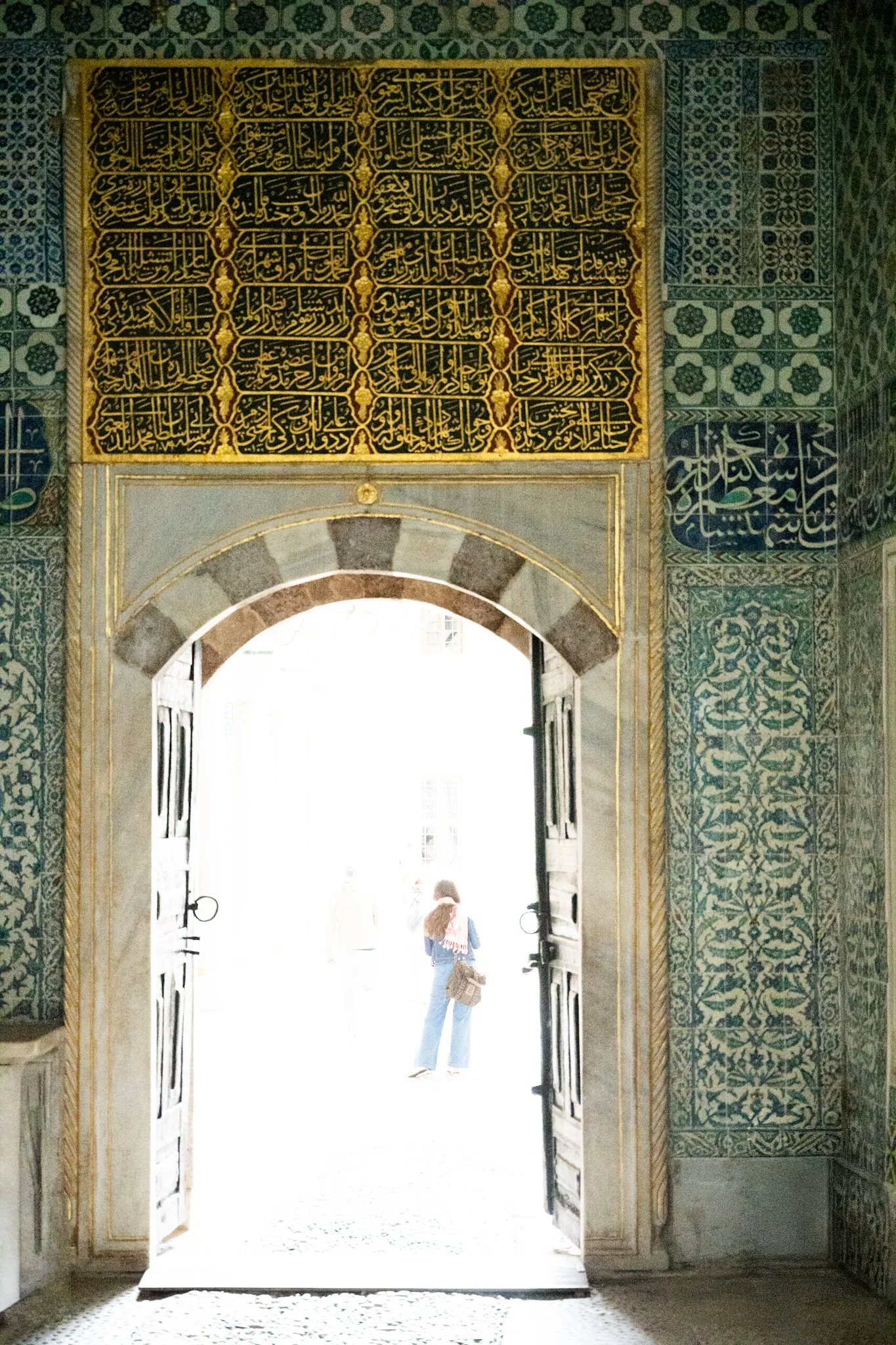 WOMAN IN THE LIGHT OF THE COURTYARD