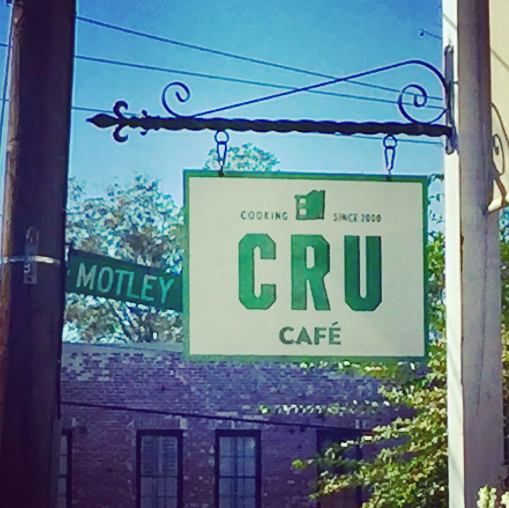 An interesting juxtaposition of signs at Cru Cafe. 