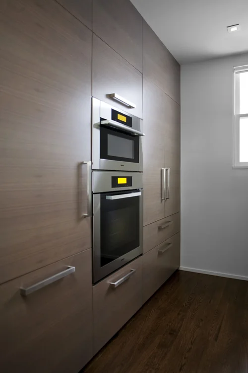Outdoor Rooftop in a San Francisco home designed by Marin interior designer Studio SQUIRE featuring Wood Cabinets, Stainless Steel Appliances, and Chrome Hardware