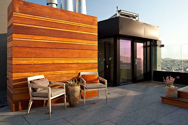 Outdoor Rooftop in a San Francisco home designed by Marin interior designer Studio SQUIRE featuring Glass Windscreen Panels and Outdoor Seating