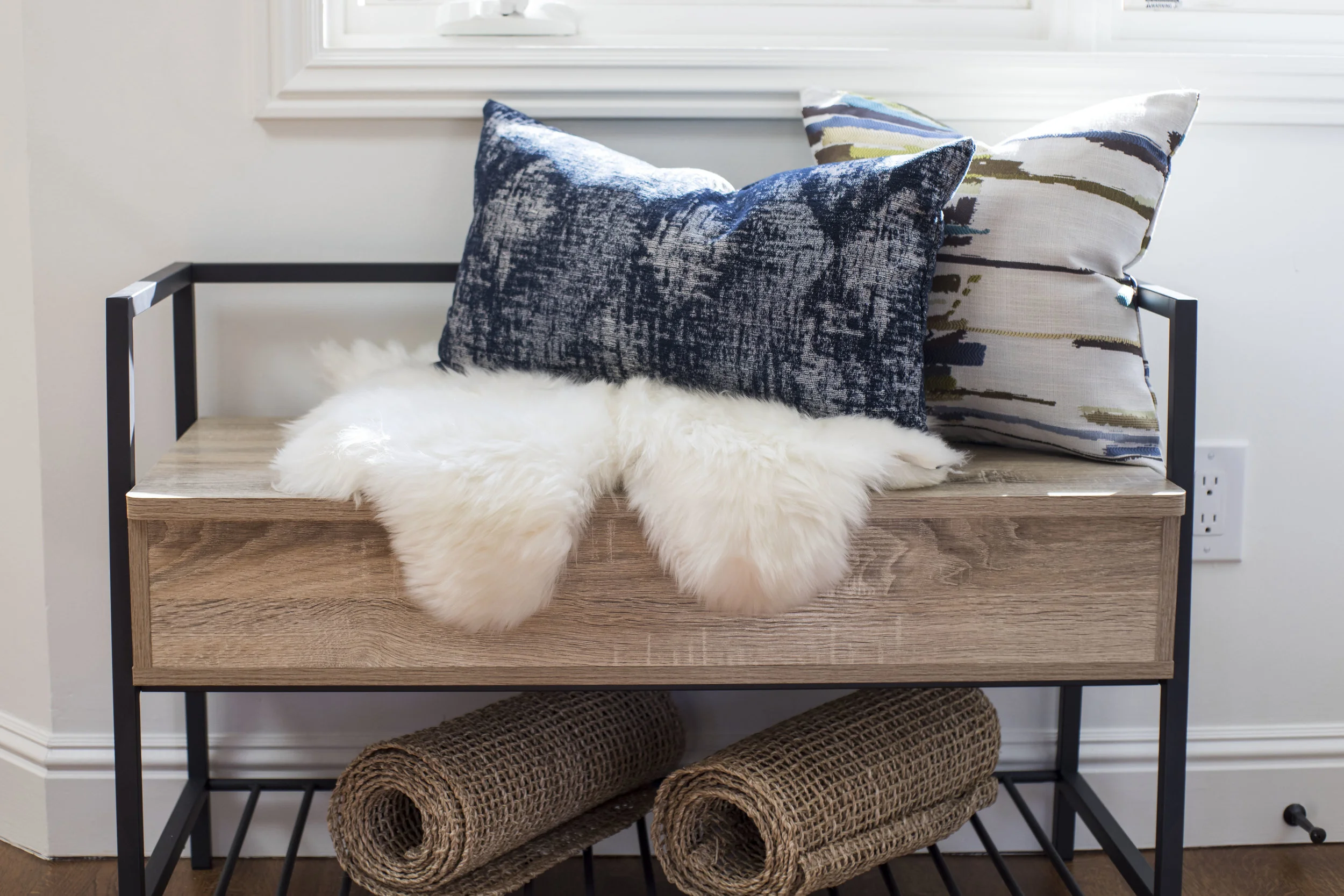 Entry Storage in Mill Valley designed by Marin interior designer Studio SQUIRE featuring Wood Bench, Pillows, Burlap, and Sheepskin Throw