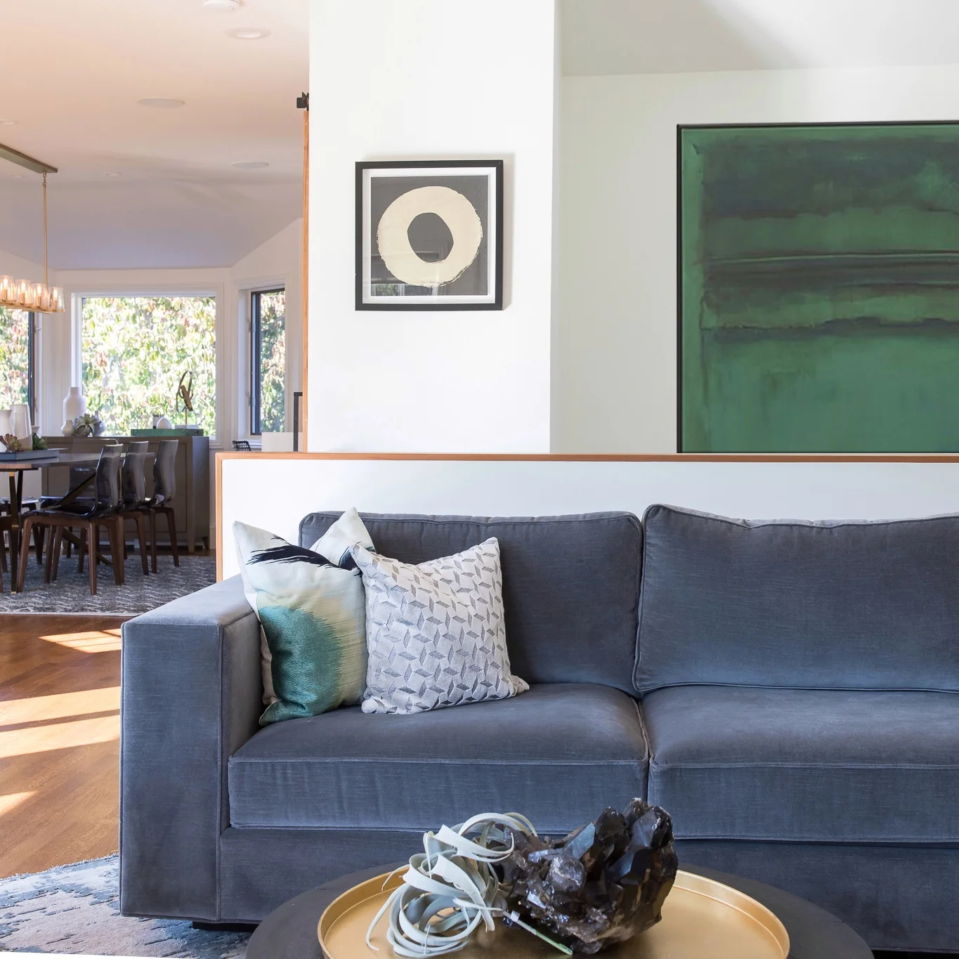 Living Room in Mill Valley designed by Marin interior designer Studio SQUIRE featuring a Upholstered Sofa, Throw Pillows, Wall Art, and Coffee Table