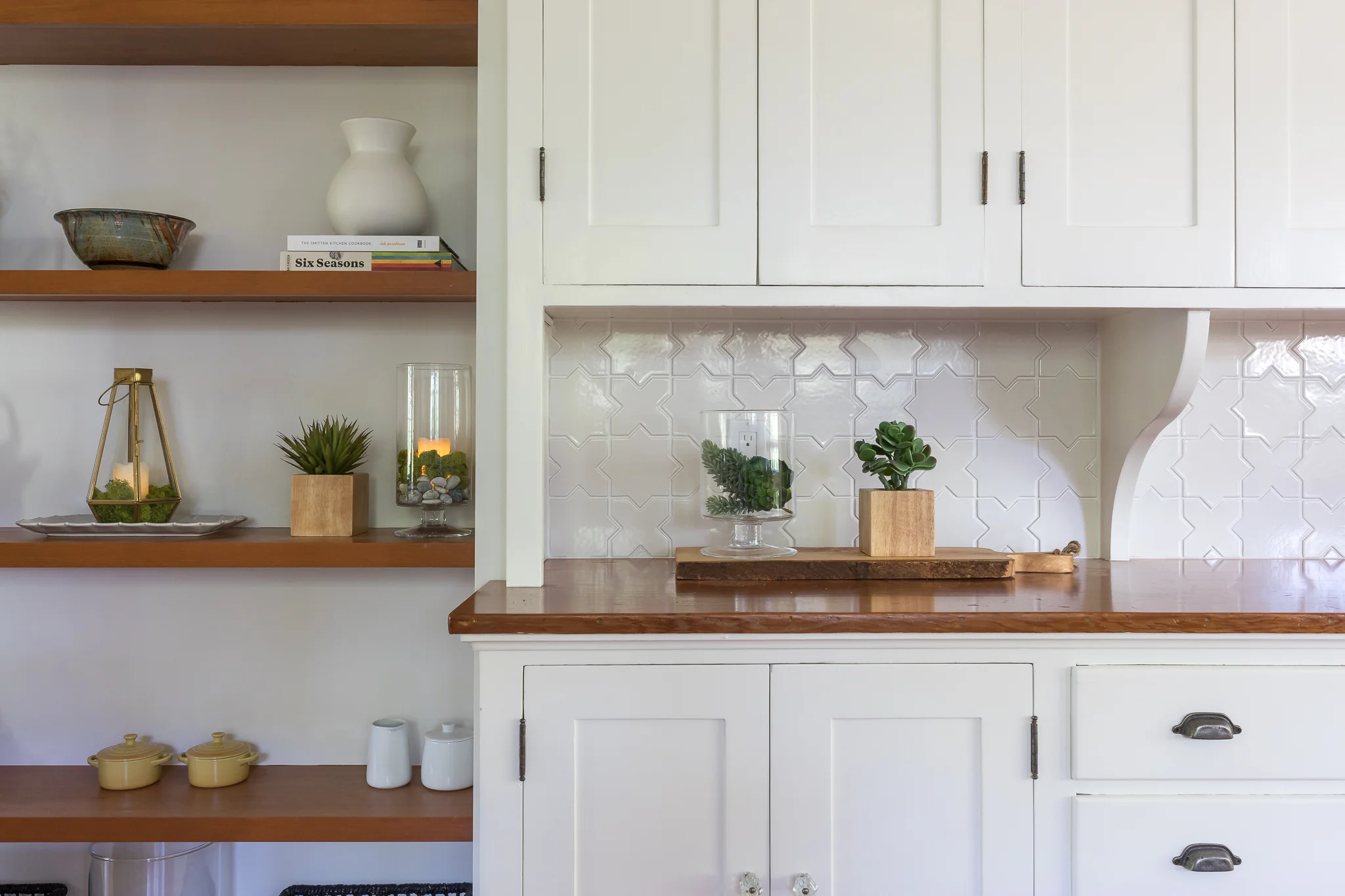 Kitchen renovation in Sausalito designed by Marin interior designer Studio SQUIRE featuring Wood Countertop, White Cabinets, Wood Shelves, and Tile Backsplash