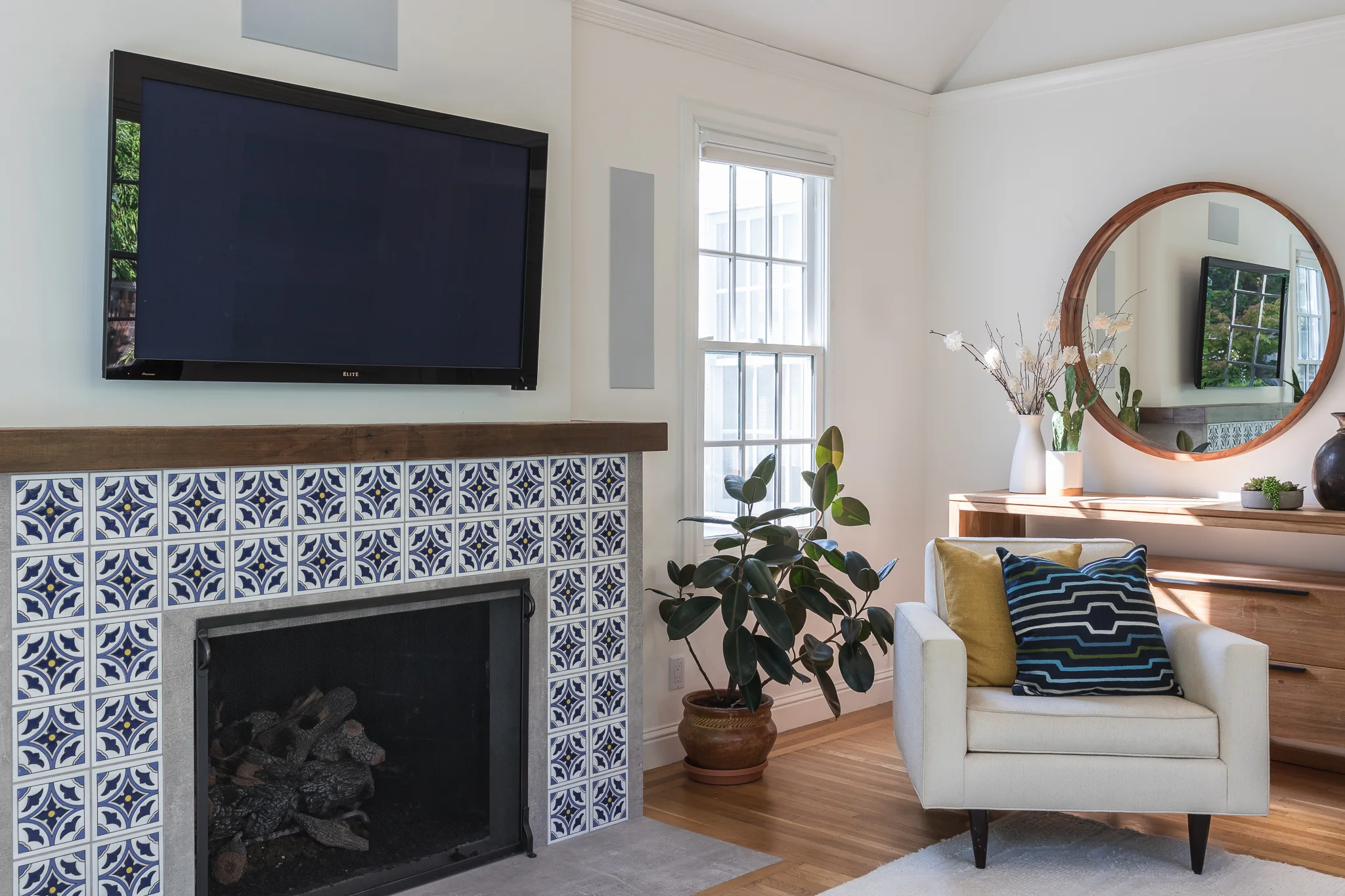 Studio SQUIRE | Marin County and SF Bay Area Interior Design Firm | Marin Project | Modern Living Room Design |   | Custom Fireplace Design | Hand Painted Blue Tile | Round Mirror