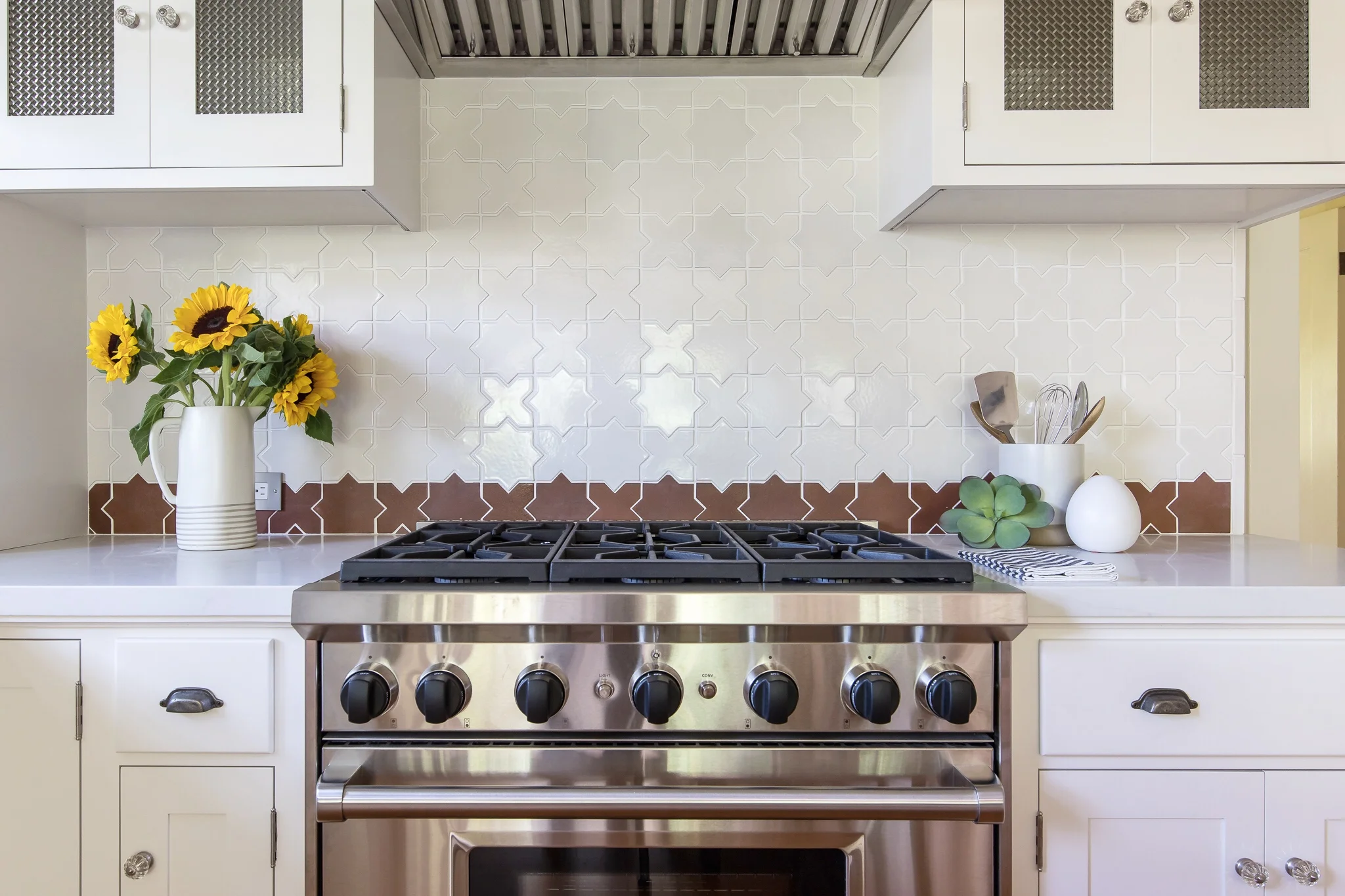 Kitchen renovation in Sausalito designed by Marin interior designer Studio SQUIRE featuring Morrocan Tile, Stainless Steel Appliances, Quartz Countertop and White Cabinets,