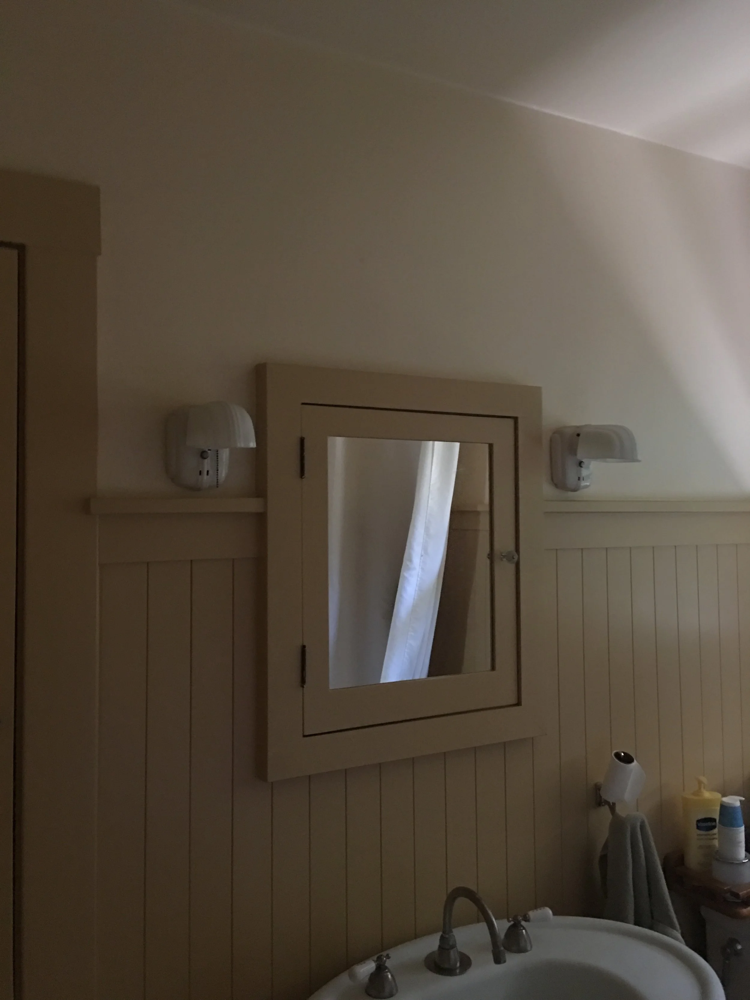 Bathroom renovation before photos in Sausalito designed by Marin interior designer Studio SQUIRE featuring Small Medicine Cabinet and Existing Pedestal Sink