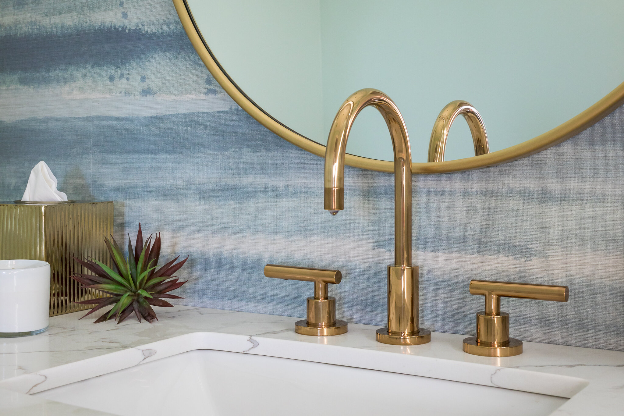 Powder room renovation in Tiburon designed by Marin interior designer Studio SQUIRE featuring brass plumbing fixtures and a coastal modern wallpaper mural.