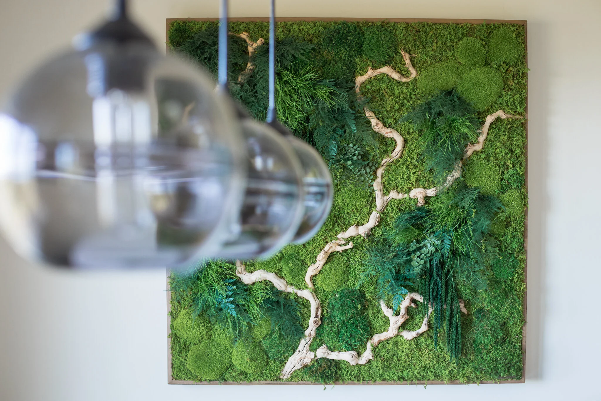 Kitchen renovation in Tiburon designed by Marin interior designer Studio SQUIRE featuring a modern breakfast nook with a custom preserved moss plant painting.