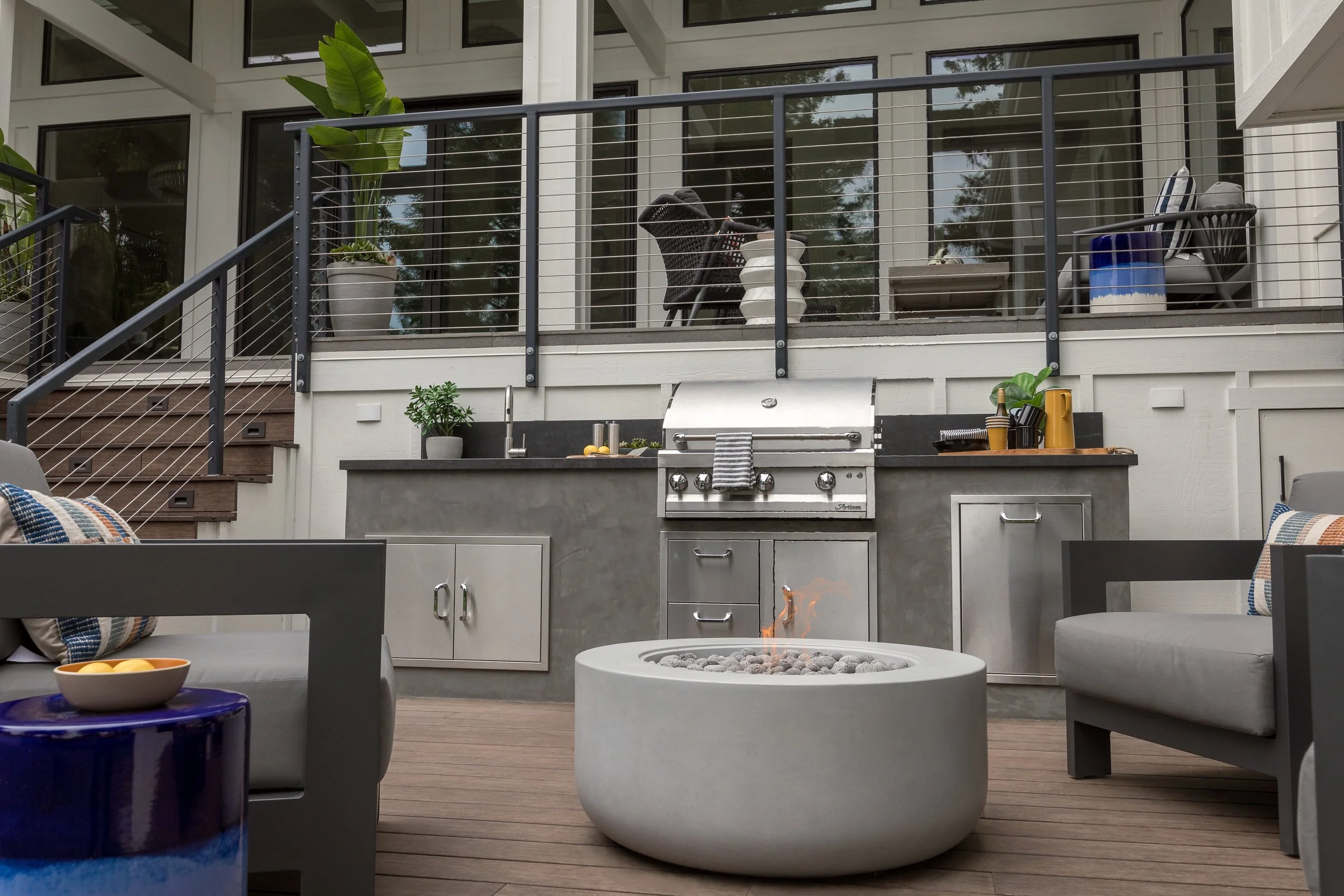 Luxury outdoor renovation with outdoor kitchen and fire pit