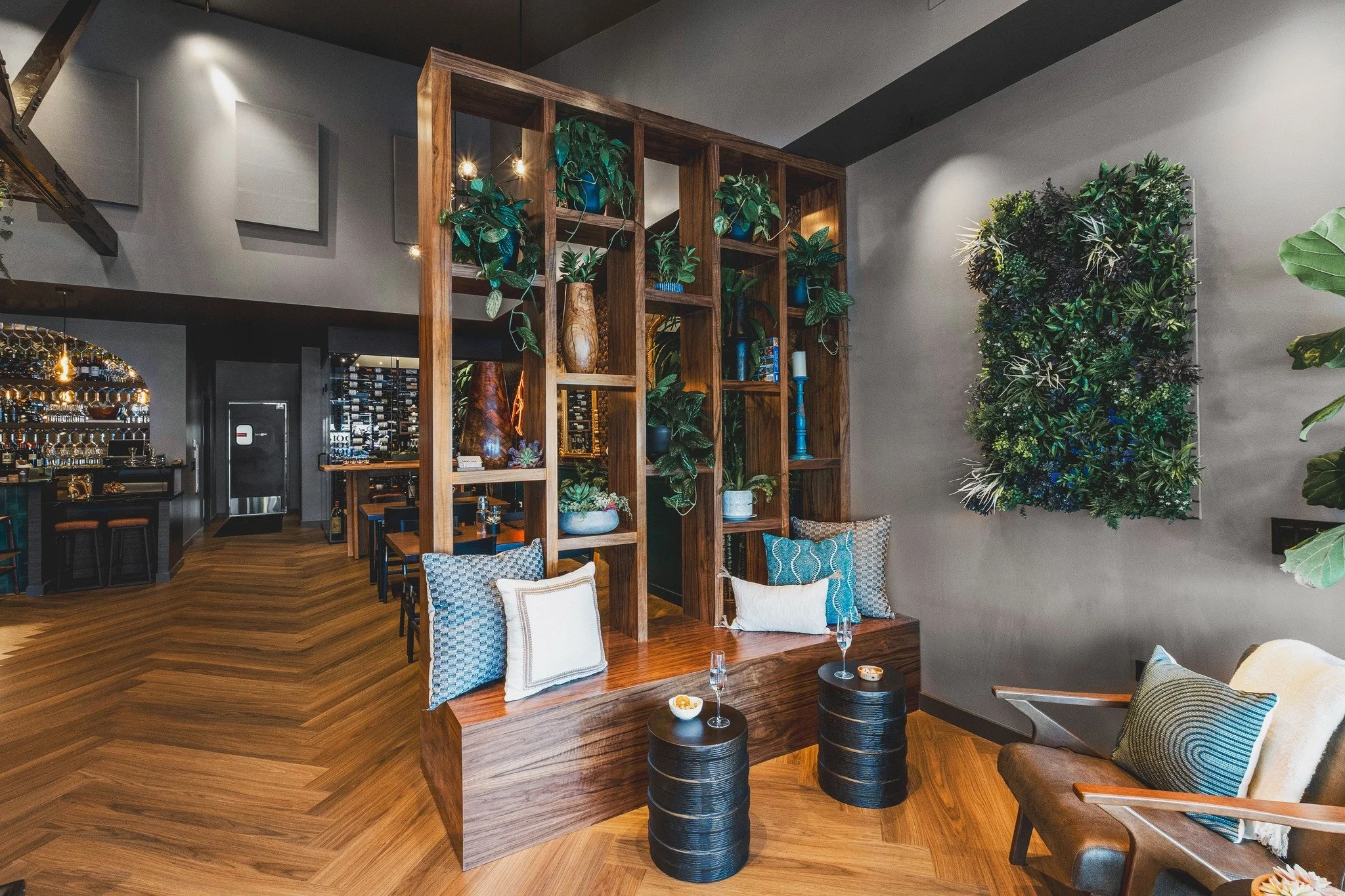 Step into this entryway and everything slows down just a little. We designed the Mog Asu Wine Bar&rsquo;s waiting area to be a moment of pause before the experience unfolds, a calm, welcoming space that invites you to settle in. Warm finishes, layere