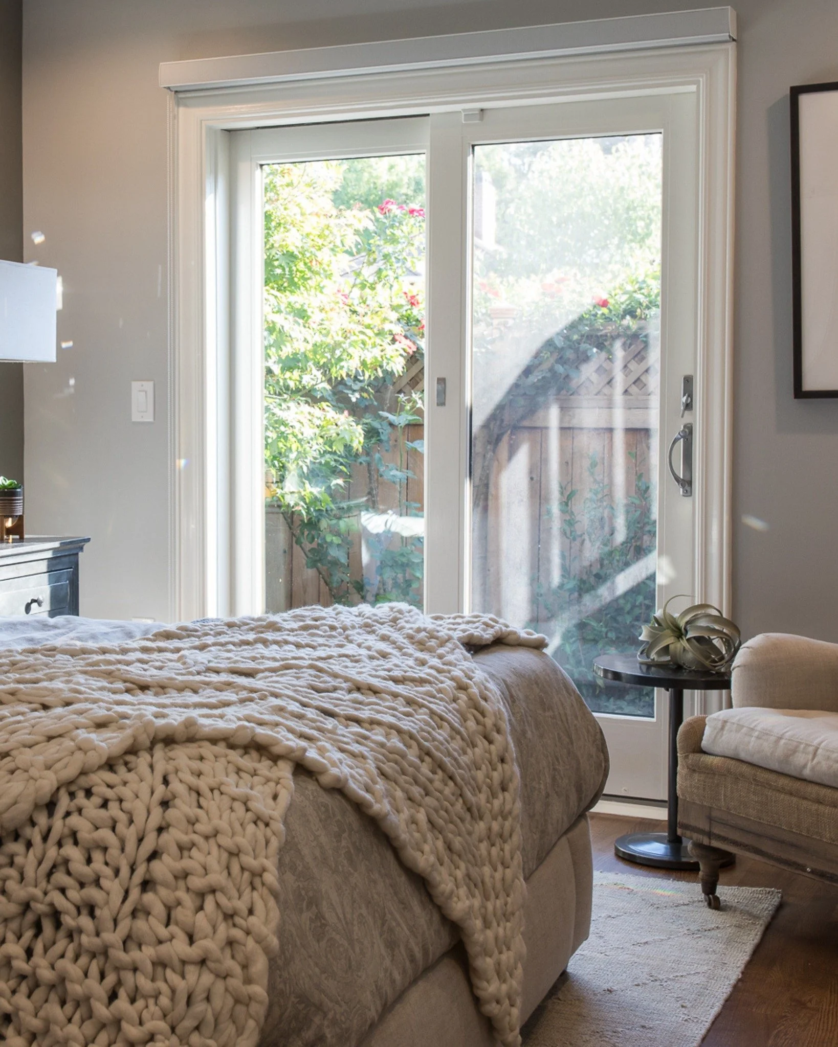 You want a bedroom that feels cozy at night and clear in the morning.

We designed this space to support the day-to-day, not fight it. 

Soft upholstery and warm wood keep it grounded, darker accents add definition, and layered lighting keeps the roo