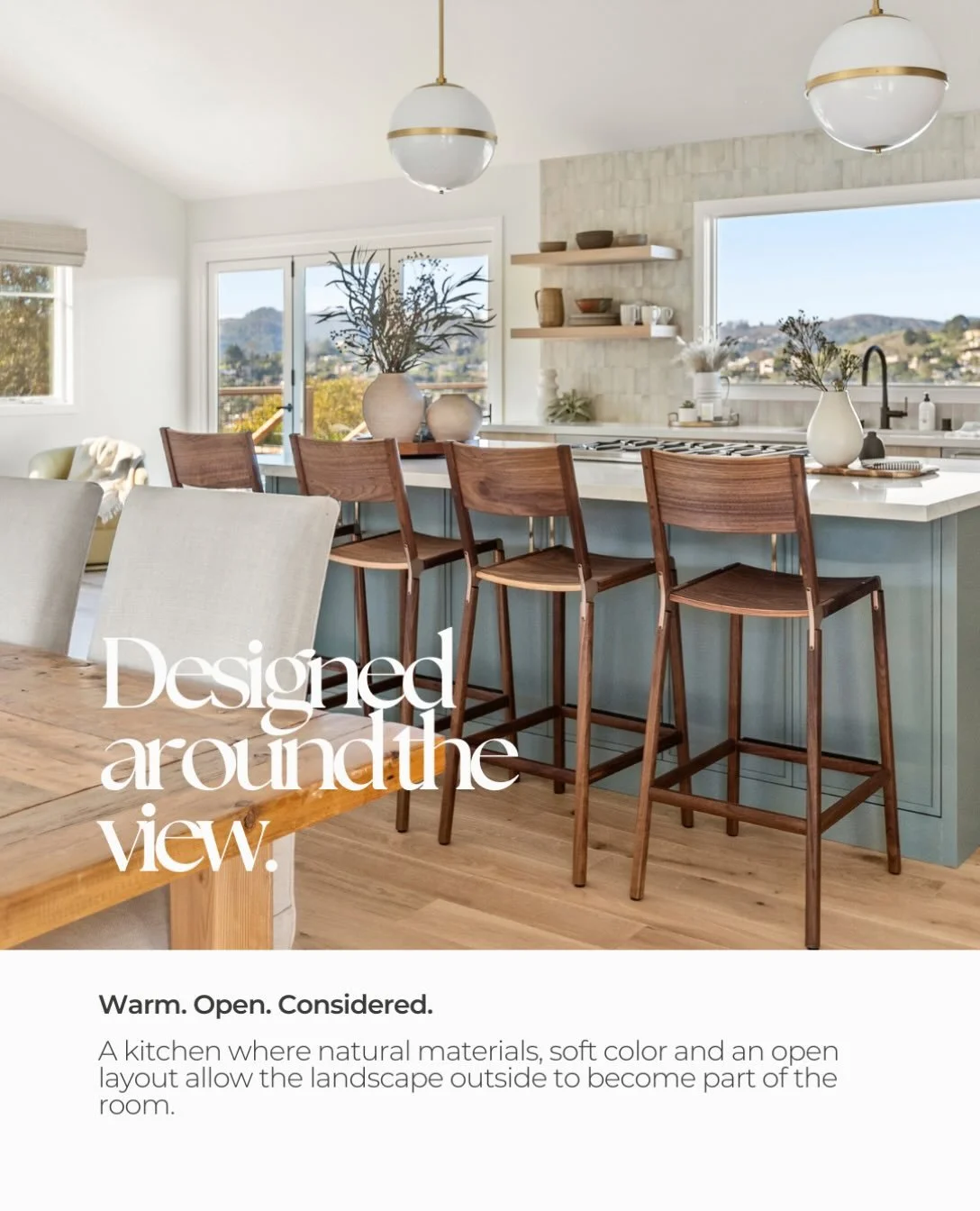Sometimes the best place to begin a design is by looking outside.

With an expansive view like this, we wanted the kitchen to feel connected to its surroundings rather than compete with them. The large picture window draws your eye beyond the room, w