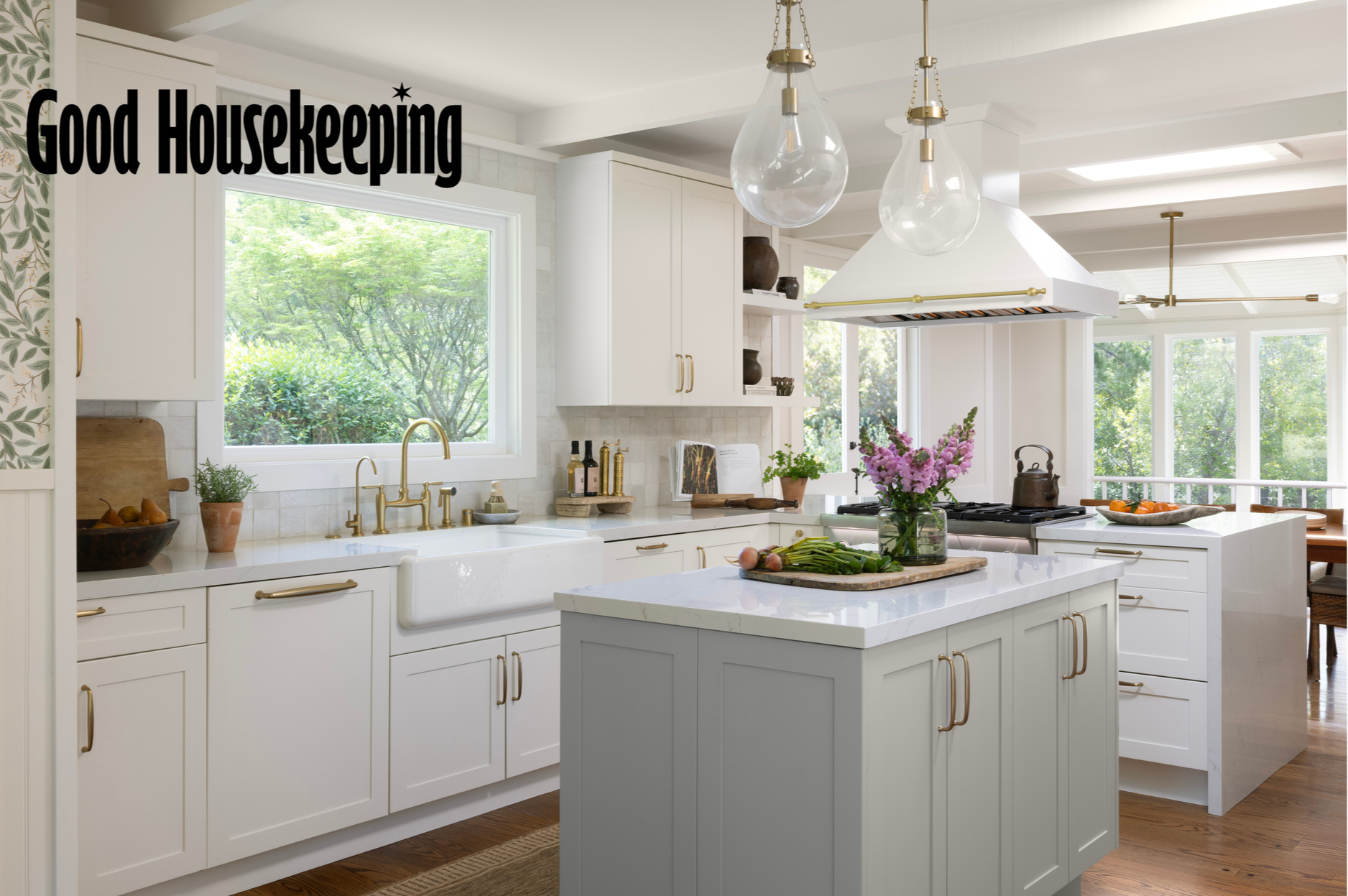 Kitchen renovation in Kentfield designed by Marin interior designer Studio SQUIRE featuring hana sky quartz countertops, handmade tile, brass hardware, and pendant lighting