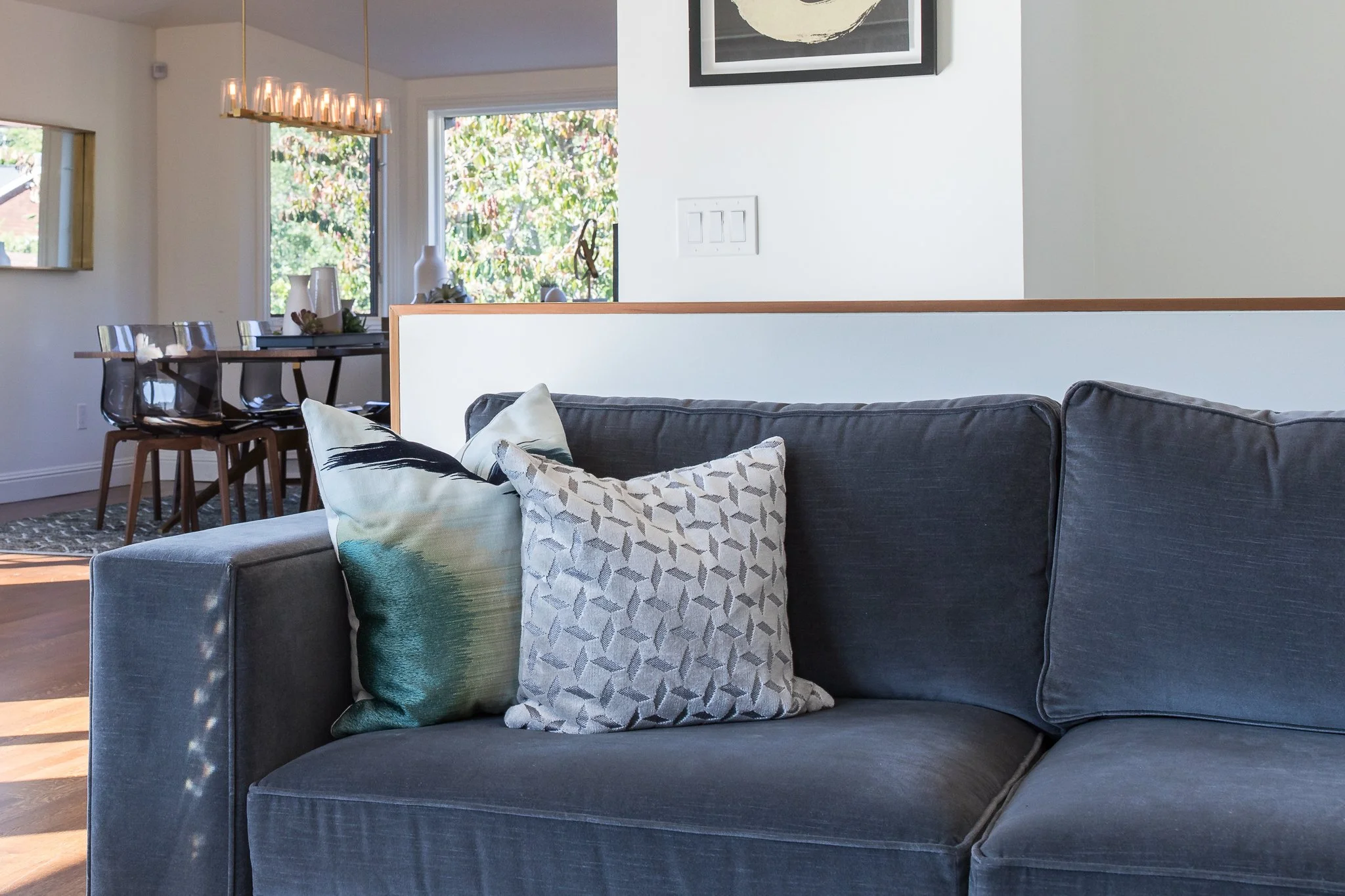 Living Room renovation in Mill Valley designed by Marin interior designer Studio SQUIRE featuring a blue velvet sofa and accent pillows