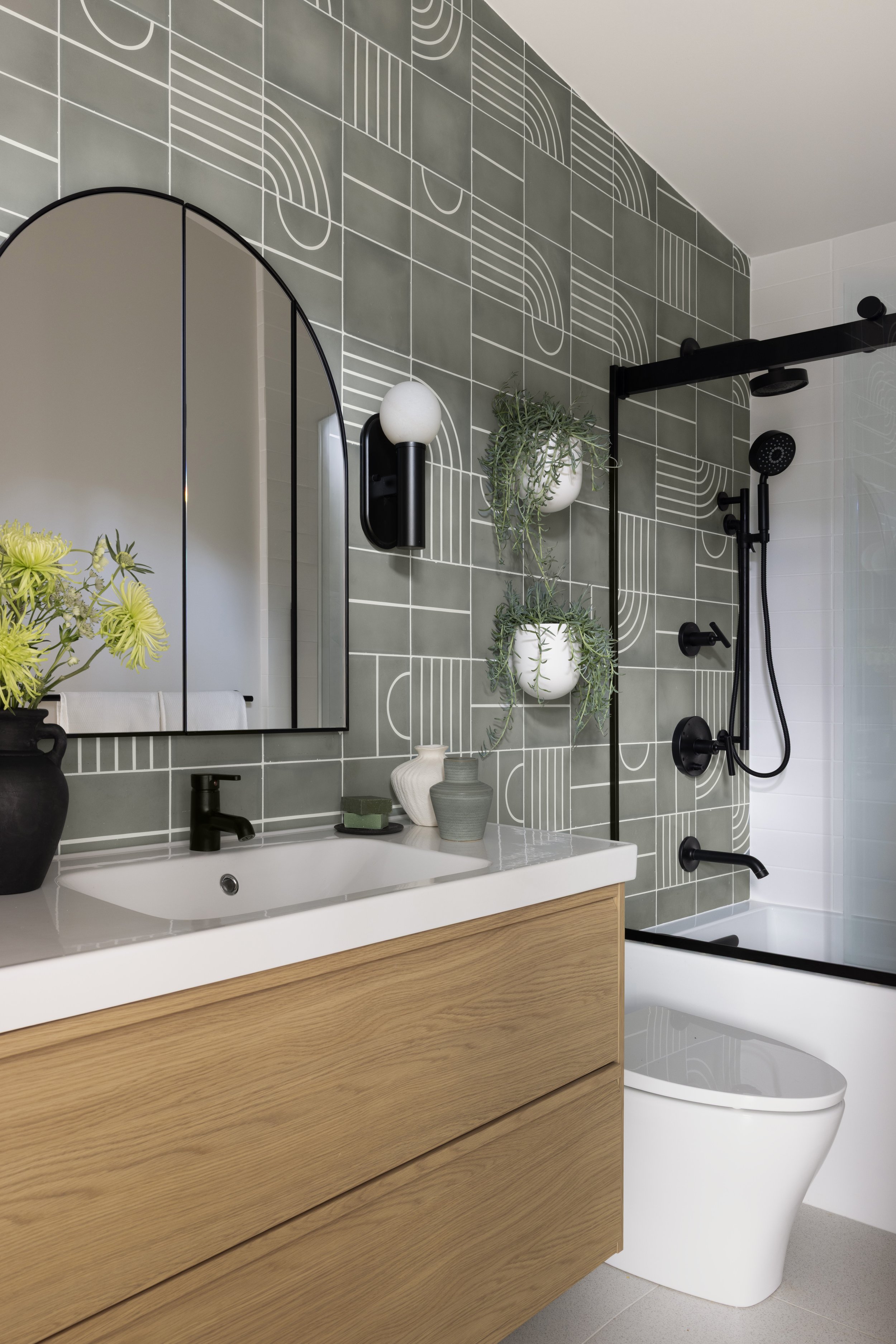 ADU renovation in Mill Valley designed by Marin interior designer Studio SQUIRE featuring Wood Vanity, Accent Tile, and Black Hardware